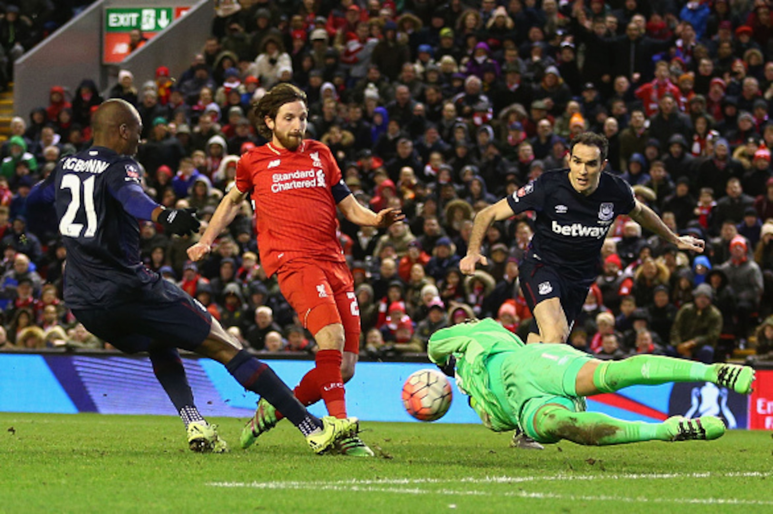LIVERPOOL, ENGLAND - JANUARY 30: Joe Allen of Liverpool is foiled by goalkeeper Darren Randolph and Angelo Ogbonna Obinza of West Ham United during the Emirates FA Cup Fourth Round match between Liverpool and West Ham United at Anfield on January 30, 201 LIVERPOOL, ENGLAND - JANUARY 30: Joe Allen of Liverpool is foiled by goalkeeper Darren Randolph and Angelo Ogbonna Obinza of West Ham United during the Emirates FA Cup Fourth Round match between Liverpool and West Ham United at Anfield on January 30, 201