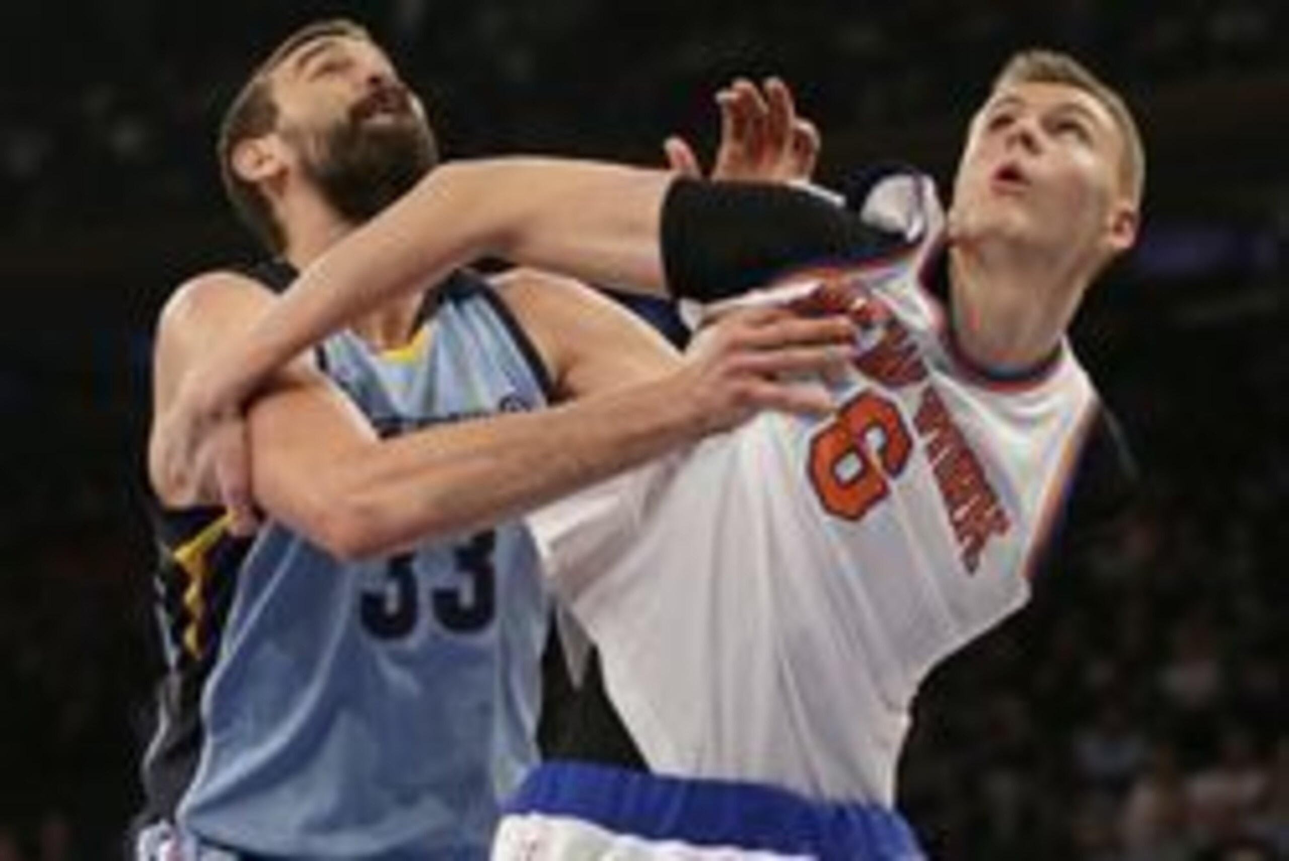 Feb 5, 2016; New York, NY, USA; New York Knicks forward Kristaps Porzingis (6) and Memphis Grizzlies center Marc Gasol (33) battle for a rebound during the first half at Madison Square Garden. Mandatory Credit: Adam Hunger-USA TODAY Sports