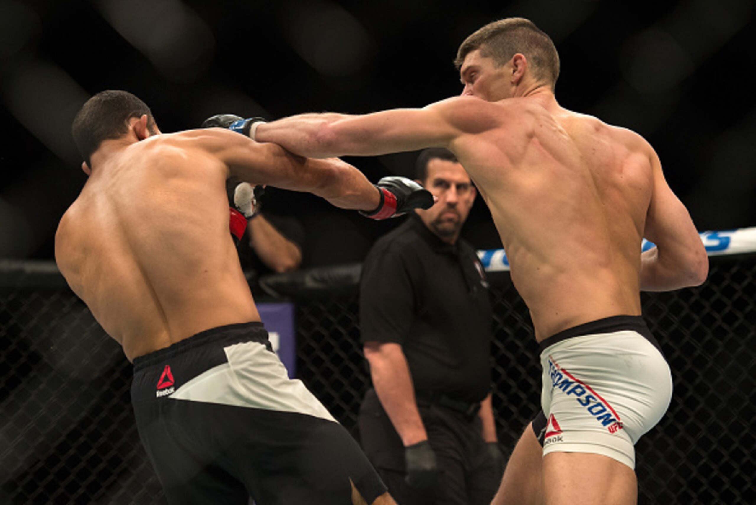 LAS VEGAS, NEVADA - FEBRUARY 06:   (R-L) Stephen Thompson punches Johny Hendricks in their welterweight bout during the UFC Fight Night Las Vegas: Hendricks vs Thompson event inside MGM Grand Garden Arena on February 6, 2016 in Las Vegas Nevada. (Photo by