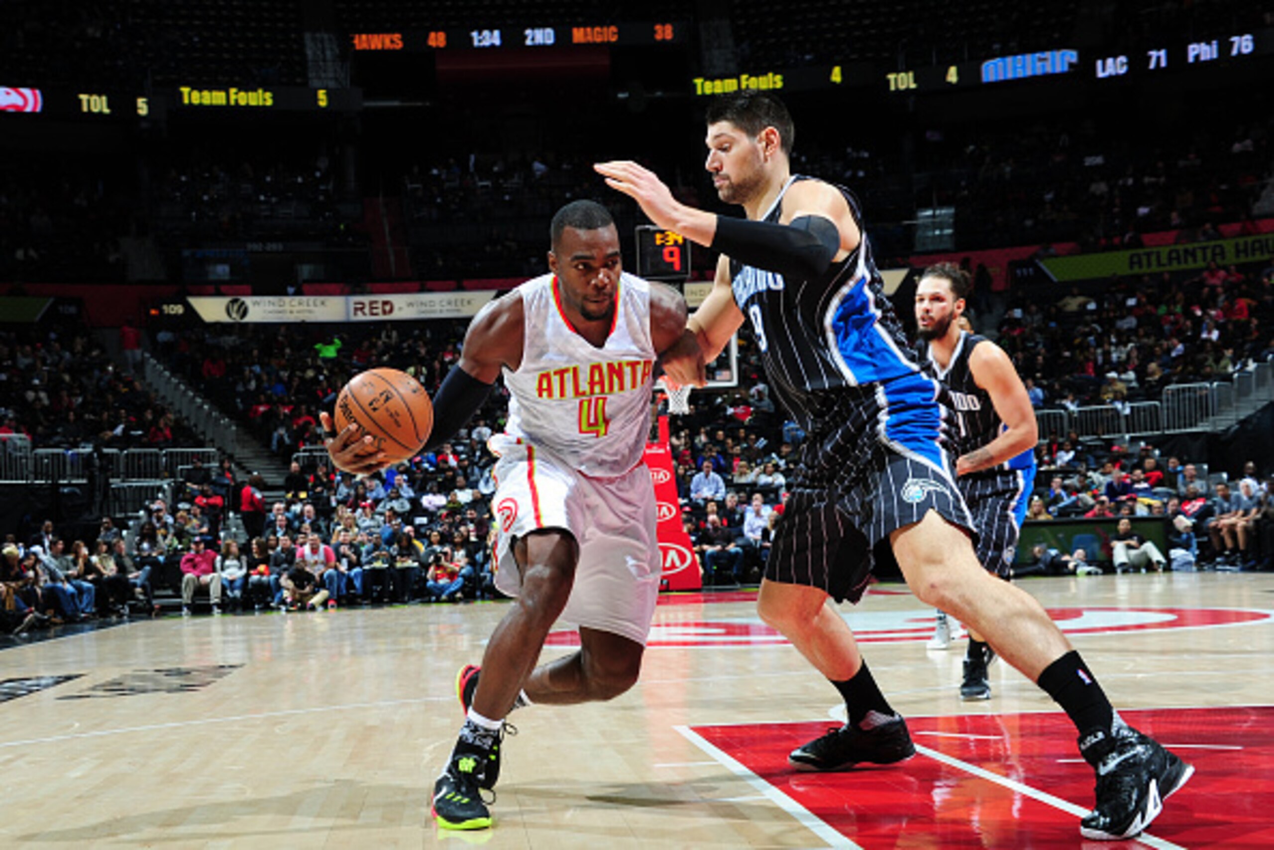 ATLANTA, GA - FEBRUARY 8: Paul Millsap #4 of the Atlanta Hawks drives to the basket against the Orlando Magic on February 8, 2016 at Philips Arena in Atlanta, Georgia.  NOTE TO USER: User expressly acknowledges and agrees that, by downloading and/or using