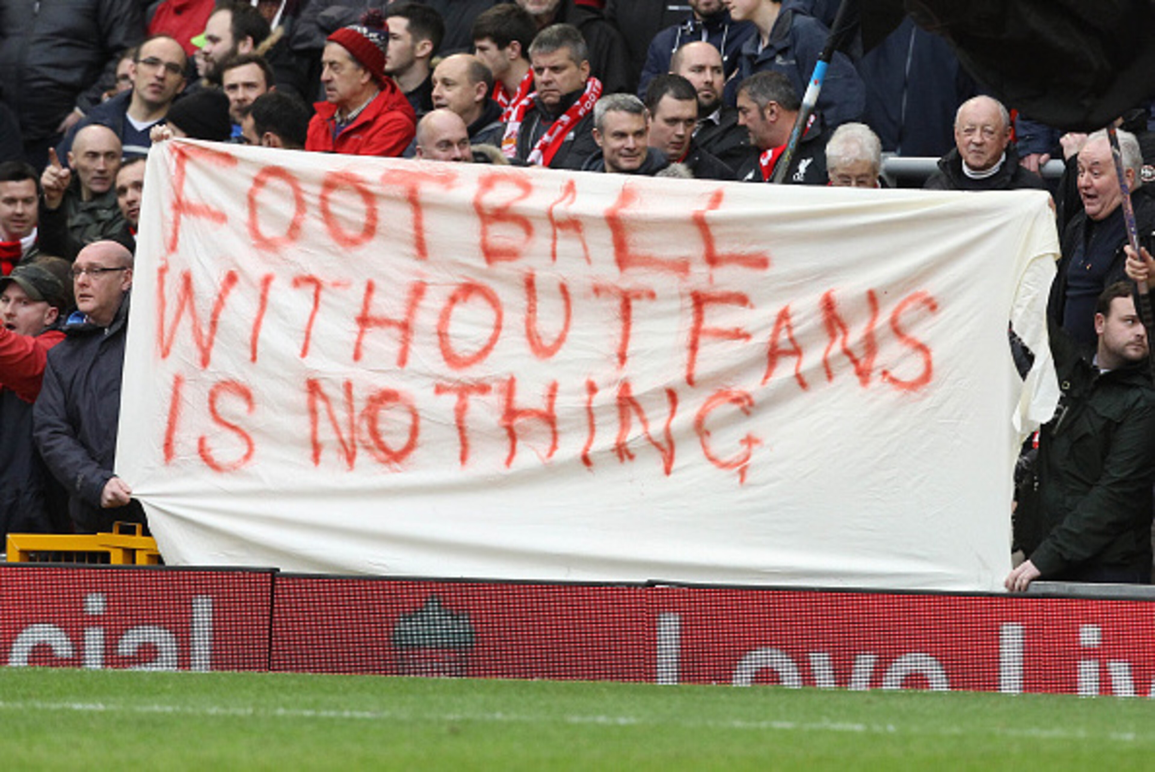 Liverpool fans hold a banner as they protest against the recently announced rise in ticket prices during the English Premier League football match between Liverpool and Sunderland at Anfield in Liverpool, northwest England, on February 6, 2016. / AFP / LI