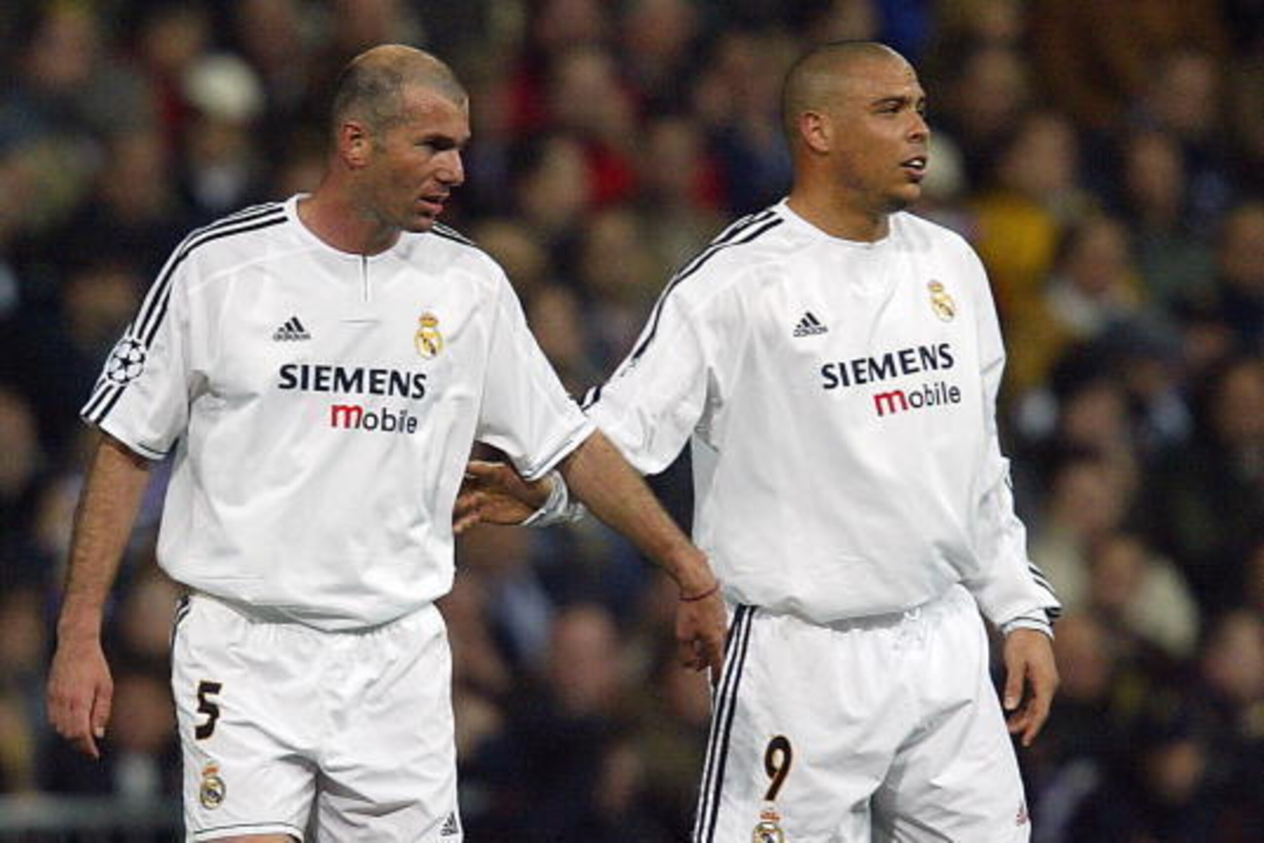 MADRID, Spain: Real Madrid's French midfielder Zinedine Zidane and his teammate Ronaldo congratulate each other after a goal during their Champions League quarter-final first leg football match against Monaco, 24 March 2004 at the Santiago Bernabeu stadi MADRID, Spain: Real Madrid's French midfielder Zinedine Zidane and his teammate Ronaldo congratulate each other after a goal during their Champions League quarter-final first leg football match against Monaco, 24 March 2004 at the Santiago Bernabeu stadi