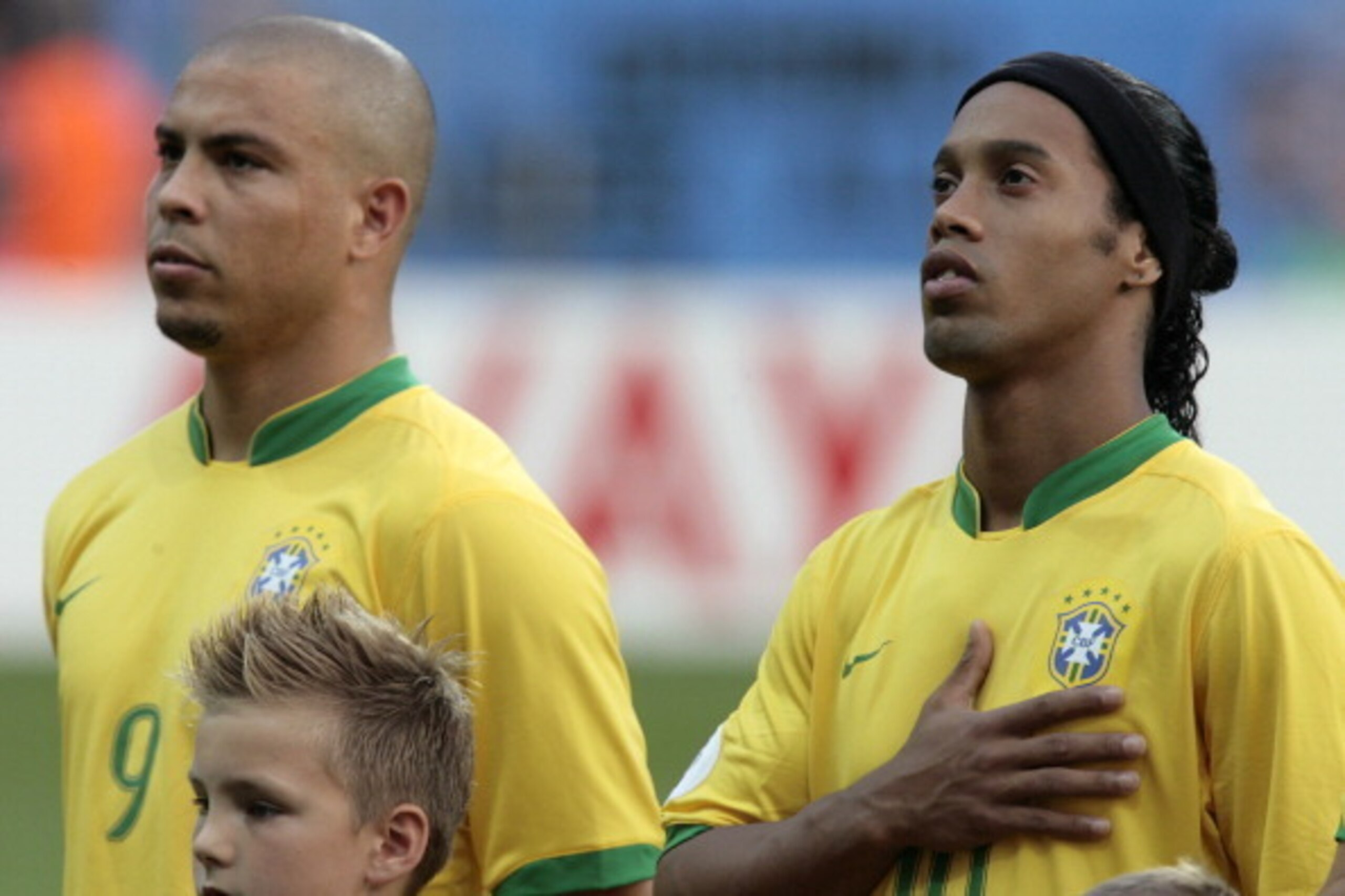 Brazilian forward Ronaldo (L) and Brazilian midfielder Ronaldinho (R) listen the national anthems at the start of the quarter-final World Cup football match between Brazil and France at Frankfurt's World Cup Stadium, 01 July 2006. The winner of this match