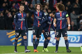 PARIS, FRANCE - JANUARY 13: Adrien Rabiot of PSG celebrates his goal between Layvin Kurzawa and David Luiz of PSG during the French League Cup (Coupe de la Ligue) match between Paris Saint-Germain (PSG) and Olympique Lyonnais (OL, Lyon) at Parc des Prince