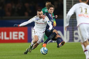 PARIS, FRANCE - JANUARY 13: Sergi Darder of Lyon and Adrien Rabiot of PSG in action during the French League Cup (Coupe de la Ligue) match between Paris Saint-Germain (PSG) and Olympique Lyonnais (OL, Lyon) at Parc des Princes stadium on January 13, 2016 