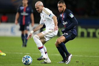 PARIS, FRANCE - JANUARY 13: Christophe Jallet of Lyon and Layvin Kurzawa of PSG in action during the French League Cup (Coupe de la Ligue) match between Paris Saint-Germain (PSG) and Olympique Lyonnais (OL, Lyon) at Parc des Princes stadium on January 13,