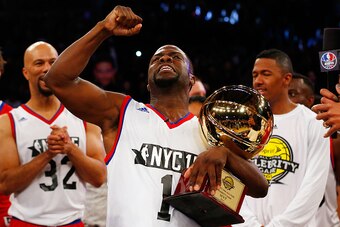 NEW YORK, NY - FEBRUARY 13:  (NEW YORK DAILIES OUT)   Comedian Kevin Hart celebrates with the MVP trophy after the Sprint NBA All-Star Celebrity Game at Madison Square Garden on February 13, 2015 in New York City.  NOTE TO USER: User expressly acknowledge