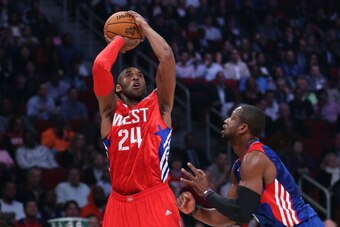 HOUSTON, TX - FEBRUARY 17:  Kobe Bryant #24 of the Los Angeles Lakers and the Western Conference shoots over Dwyane Wade #3 of the Miami Heat and the Eastern Conference in the first quarter during the 2013 NBA All-Star game at the Toyota Center on Februar