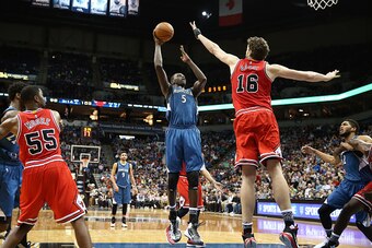 MINNEAPOLIS, MN - FEBRUARY 6: Gorgui Dieng #5 of the Minnesota Timberwolves shoots the ball during the game against Pau Gasol #16 of the Chicago Bulls on February 6, 2016 at Target Center in Minneapolis, Minnesota. NOTE TO USER: User expressly acknowledge