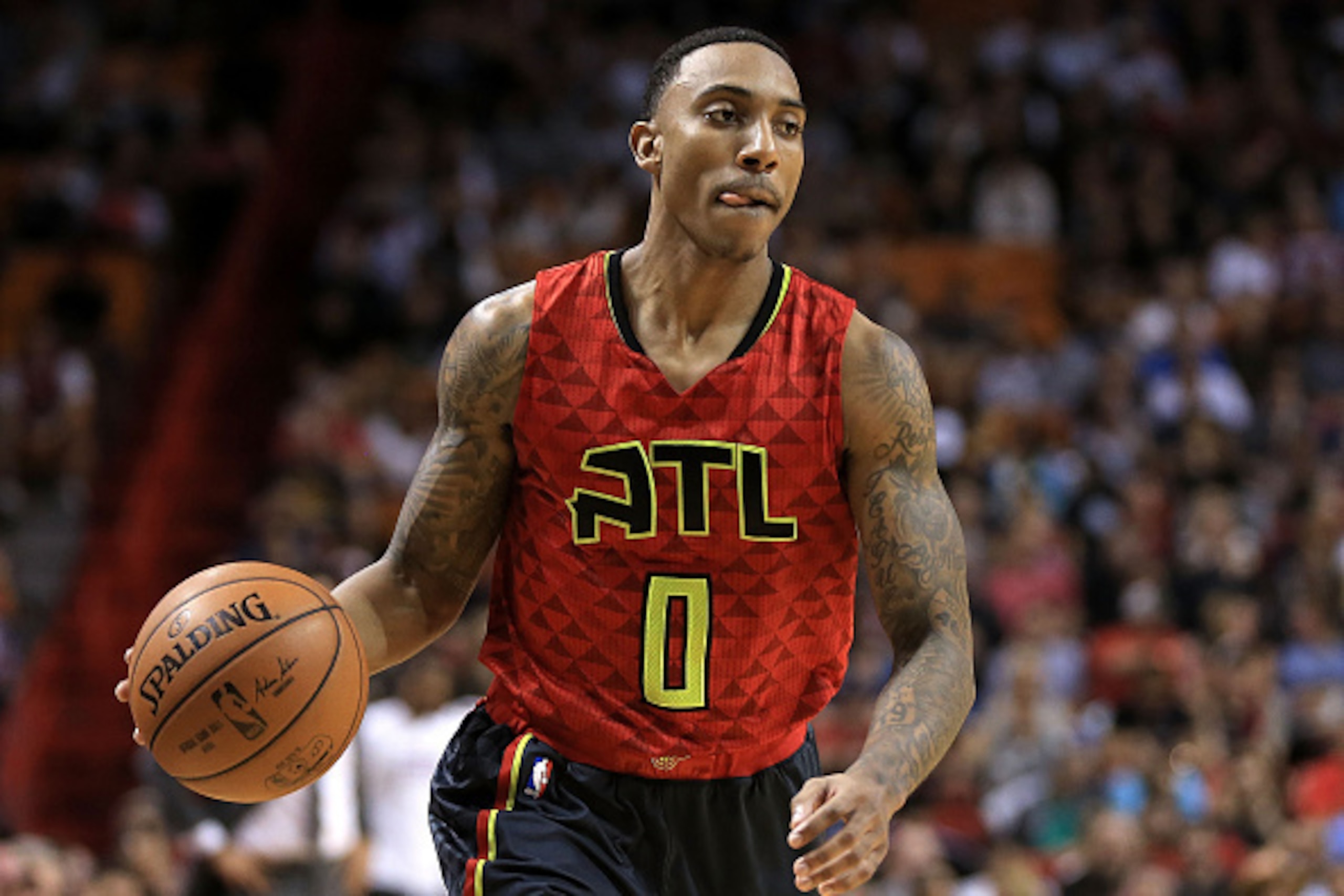 MIAMI, FL - JANUARY 31: Jeff Teague #0 of the Atlanta Hawks brings the ball up during a game against the Miami Heat at American Airlines Arena on January 31, 2016 in Miami, Florida. NOTE TO USER: User expressly acknowledges and agrees that, by downloading