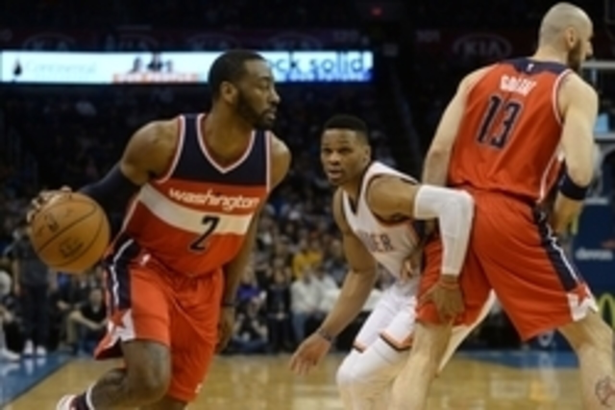 Feb 1, 2016; Oklahoma City, OK, USA; Washington Wizards guard John Wall (2) dribbles the ball around Oklahoma City Thunder guard Russell Westbrook (0) and Wizards center Marcin Gortat (13) during the first quarter at Chesapeake Energy Arena. Mandatory Cre