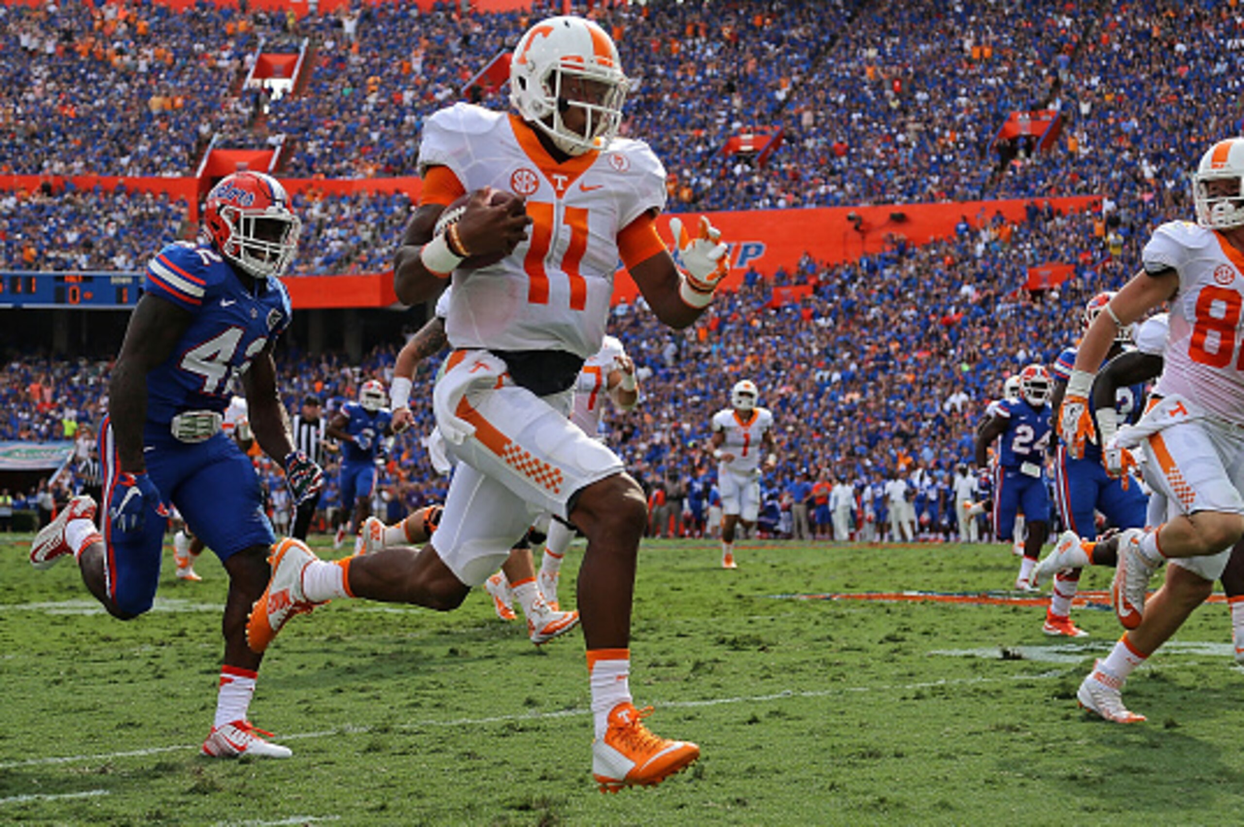 GAINESVILLE, FL - SEPTEMBER 26: Joshua Dobbs #11 of the Tennessee Volunteers rushes for a touchdown during a game against the Florida Gators at Ben Hill Griffin Stadium on September 26, 2015 in Gainesville, Florida. (Photo by Mike Ehrmann/Getty Images) GAINESVILLE, FL - SEPTEMBER 26: Joshua Dobbs #11 of the Tennessee Volunteers rushes for a touchdown during a game against the Florida Gators at Ben Hill Griffin Stadium on September 26, 2015 in Gainesville, Florida. (Photo by Mike Ehrmann/Getty Images)