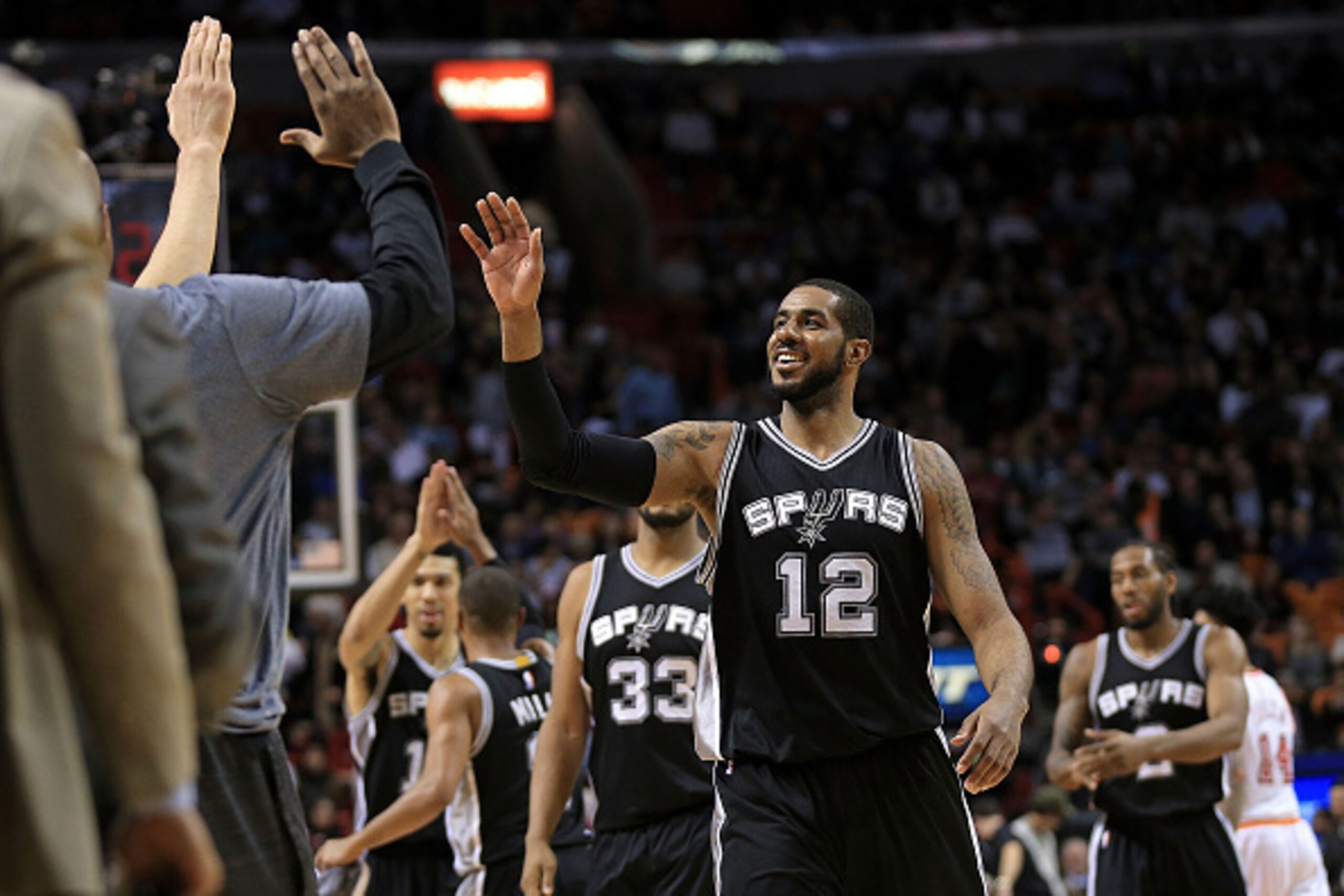MIAMI, FL - FEBRUARY 09: LaMarcus Aldridge #12 of the San Antonio Spurs high fives during a game against the Miami Heat at American Airlines Arena on February 9, 2016 in Miami, Florida. NOTE TO USER: User expressly acknowledges and agrees that, by downloa