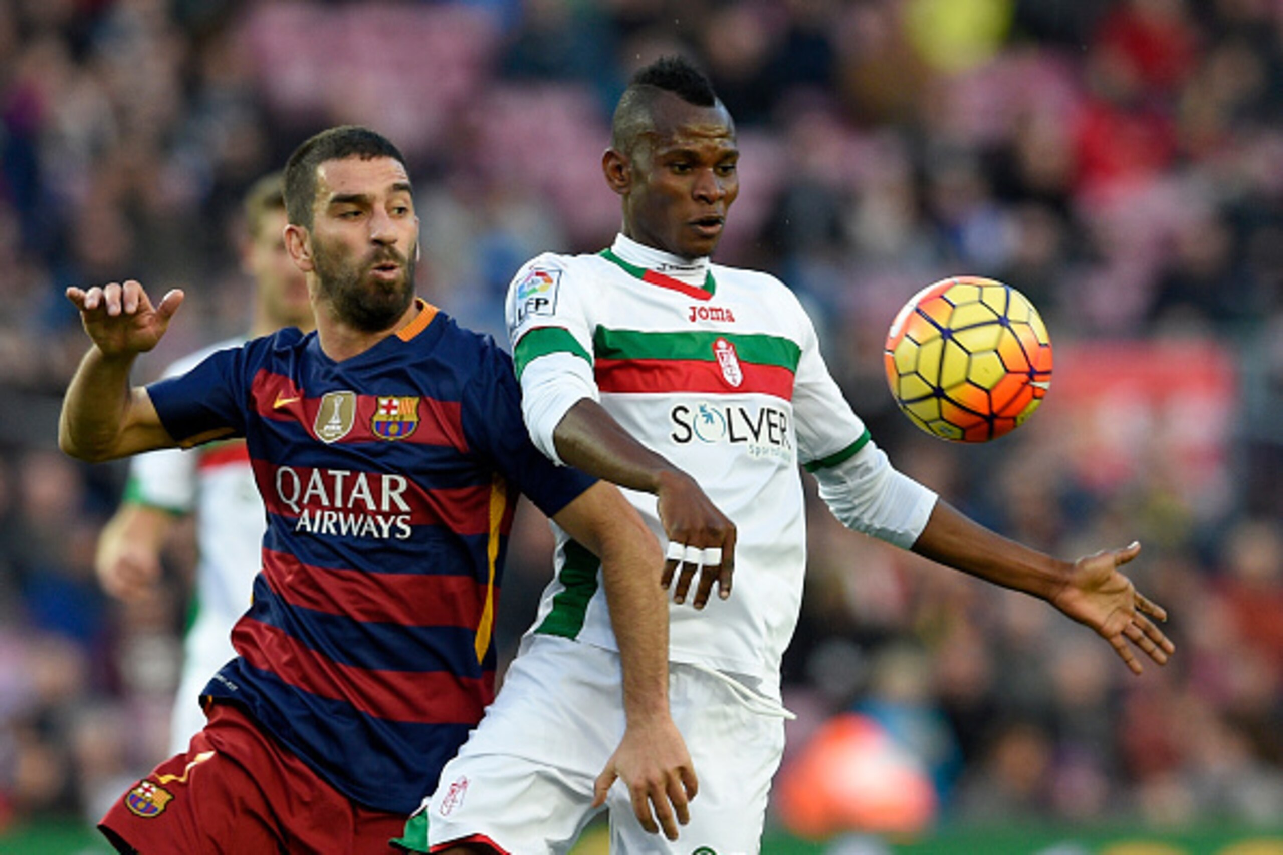 Barcelona's Turkish midfielder Arda Turan (L) vies with Granada's Nigerian midfielder Uche (R) during the Spanish league football match FC Barcelona vs Granada CF at the Camp Nou stadium in Barcelona on January 9, 2016. AFP PHOTO / LLUIS GENE / AFP / LL Barcelona's Turkish midfielder Arda Turan (L) vies with Granada's Nigerian midfielder Uche (R) during the Spanish league football match FC Barcelona vs Granada CF at the Camp Nou stadium in Barcelona on January 9, 2016. AFP PHOTO / LLUIS GENE / AFP / LL