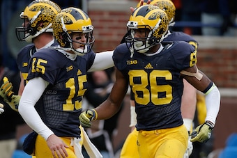 ANN ARBOR, MI - NOVEMBER 28: Quarterback Jake Rudock #15 and wide reciever Jehu Chesson #86 of the Michigan Wolverines celebrate after the pair connected for a second quarter touchdown pass against the Ohio State Buckeyes at Michigan Stadium on November 2