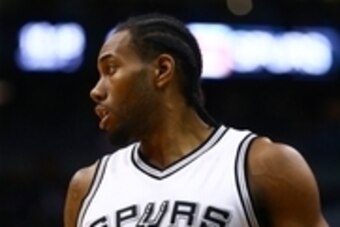 Jan 21, 2016; Phoenix, AZ, USA; San Antonio Spurs forward Kawhi Leonard (2) against the Phoenix Suns at Talking Stick Resort Arena. The Spurs defeated the Suns 117-89. Mandatory Credit: Mark J. Rebilas-USA TODAY Sports
