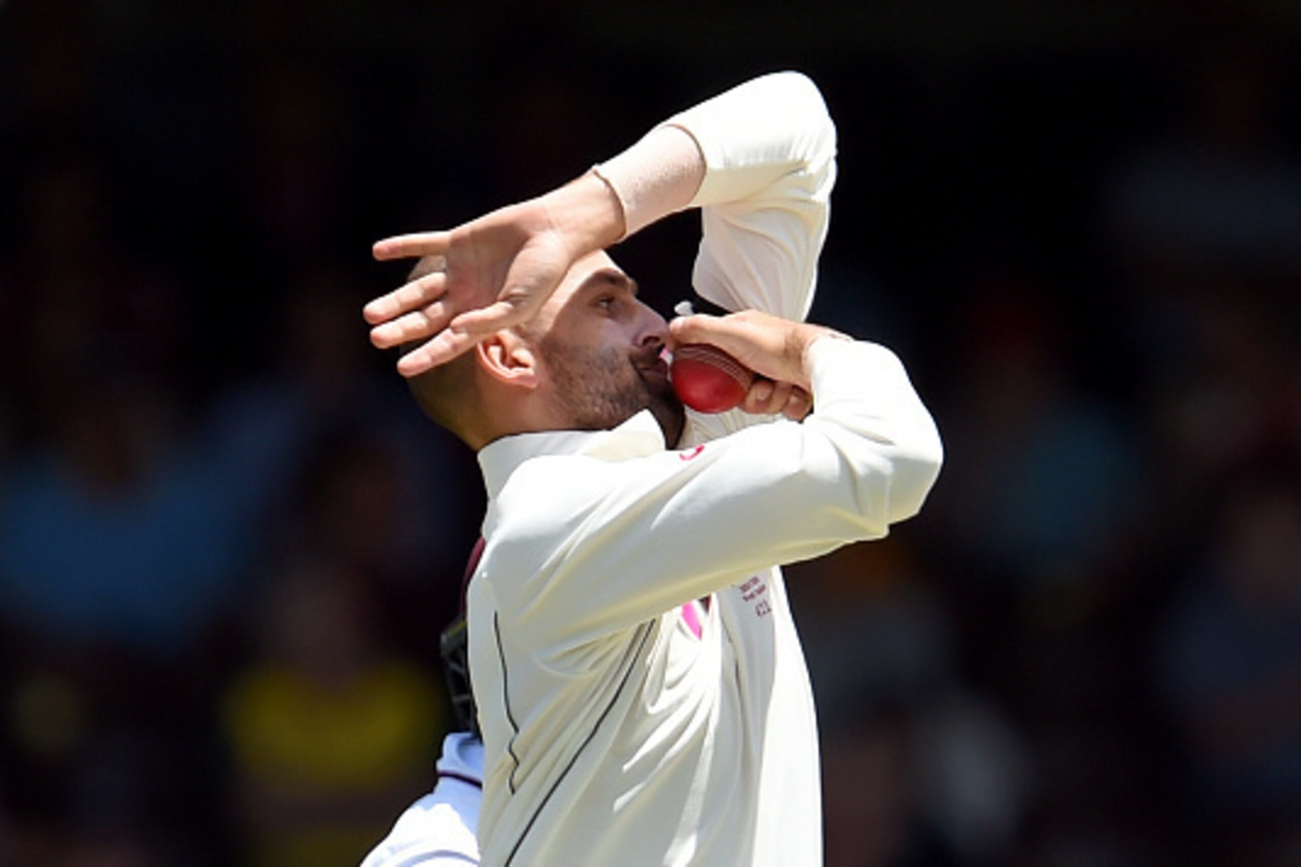 TOPSHOT - Australian spinner Nathan Lyon sends down a delivery to the West Indies batsman on the final day of the third cricket Test match in Sydney on January 7, 2016.  AFP PHOTO / William WEST  
--IMAGE RESTRICTED TO EDITORIAL USE - NO COMMERCIAL USE-- 