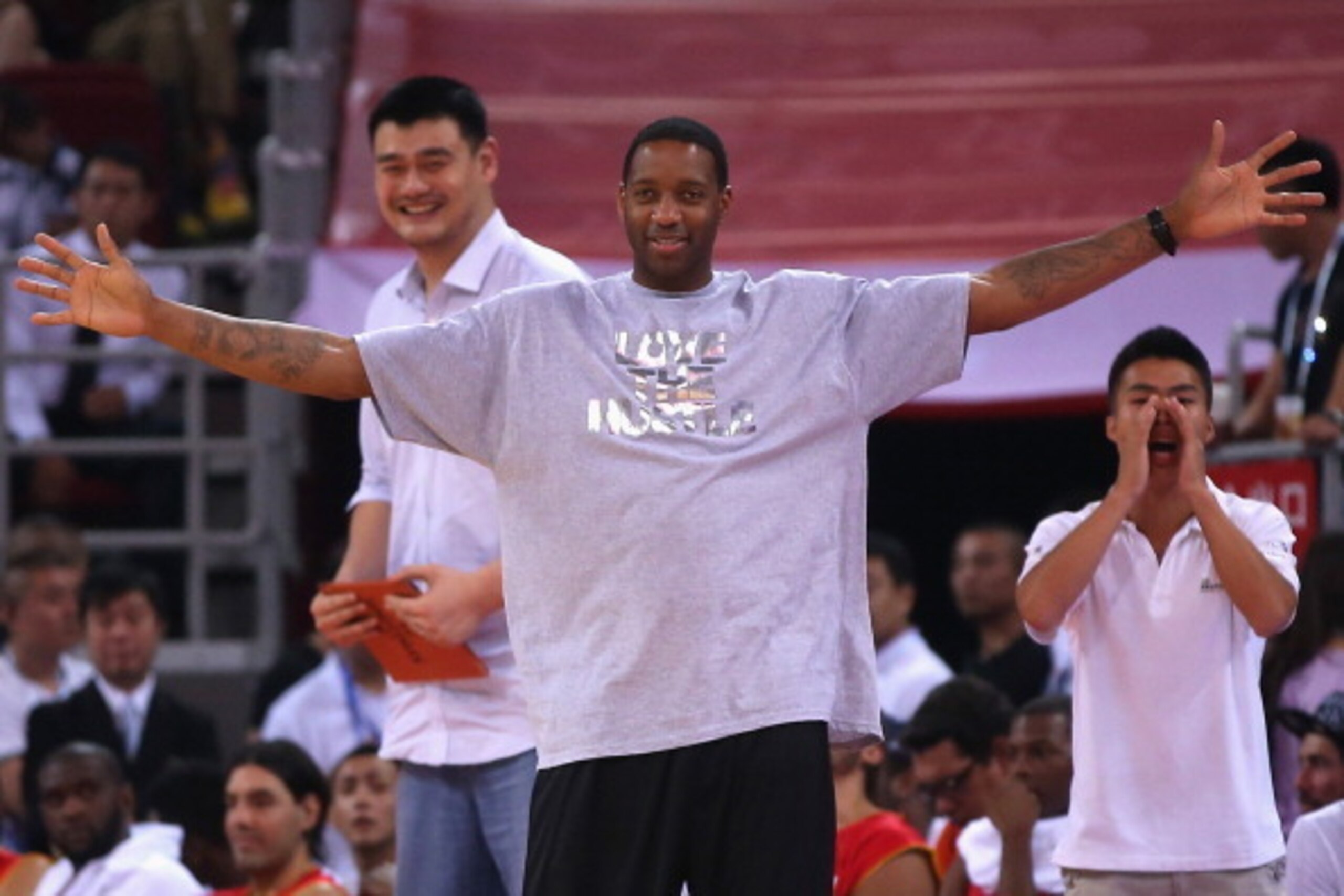 BEIJING, CHINA - JULY 01:  NBA star Tracy McGrady (Front) and Yao Ming (L) watch the Yao Foundation Charity Game, sponsored by the charity foundation initiated by former Chinese basketball star Yao Ming, during the 2013 Yao Foundation Charity Game between