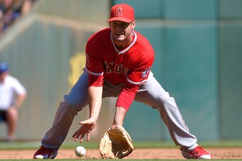 ARLINGTON, TX - OCTOBER 4: David Freese #6 of the Los Angeles Angels of Anaheim fields a ground ball during the second inning of the game against the Texas Rangers at Globe Life Park in Arlington on October 4, 2015 in Arlington, California. (Photo by Matt