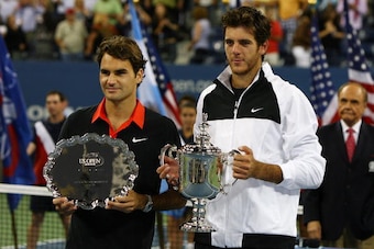 NEW YORK - SEPTEMBER 14:  (L-R) Roger Federer of Switzerland and Juan Martin Del Potro of Argentina pose with their trophies after the Men's Singles final on day fifteen of the 2009 U.S. Open at the USTA Billie Jean King National Tennis Center on Septembe