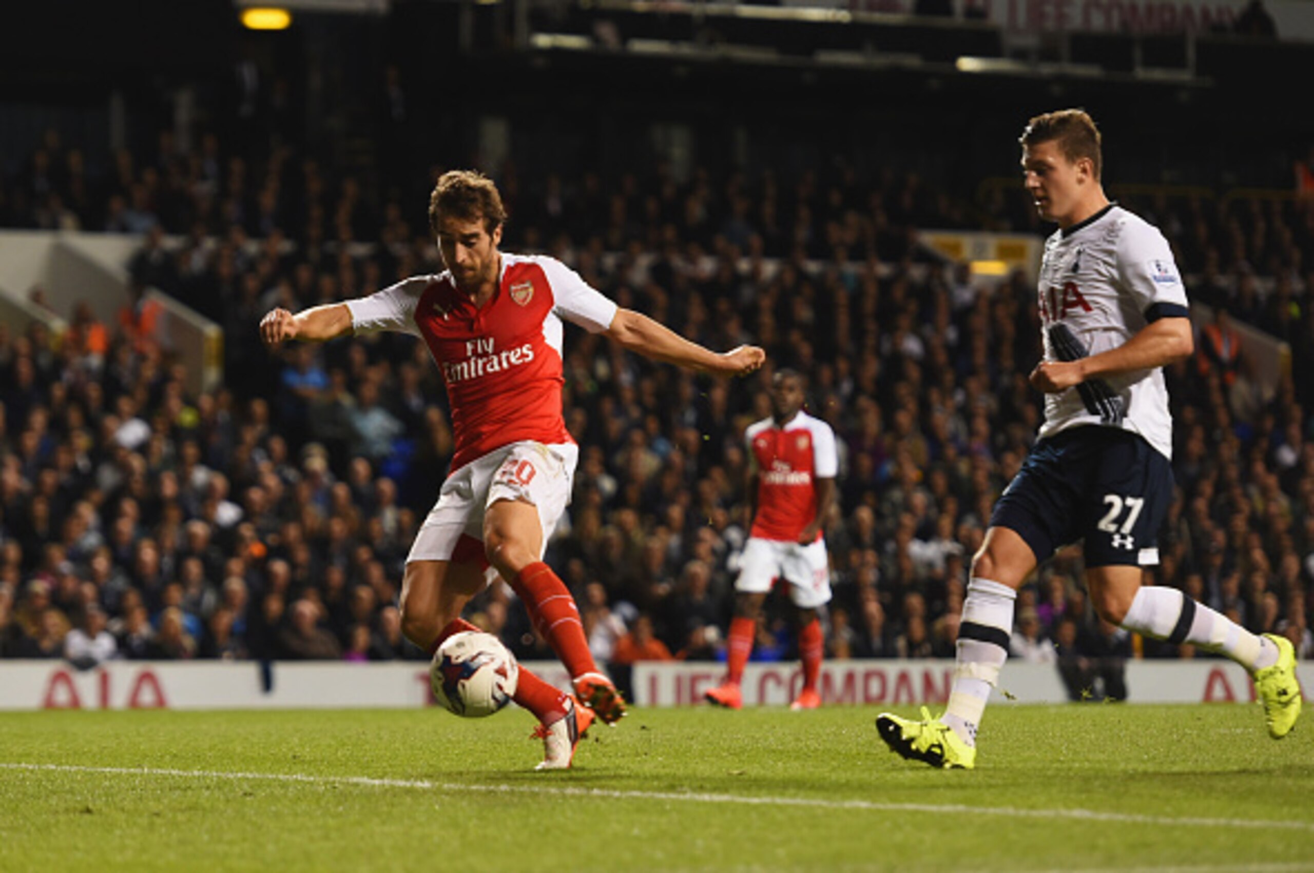 LONDON, ENGLAND - SEPTEMBER 23: Mathieu Flamini of Arsenal scores their first goal as Kevin Wimmer of Tottenham Hotspur looks on during the Capital One Cup third round match between Tottenham Hotspur and Arsenal at White Hart Lane on September 23, 2015 i LONDON, ENGLAND - SEPTEMBER 23: Mathieu Flamini of Arsenal scores their first goal as Kevin Wimmer of Tottenham Hotspur looks on during the Capital One Cup third round match between Tottenham Hotspur and Arsenal at White Hart Lane on September 23, 2015 i