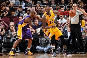 CLEVELAND, OH - FEBRUARY 10:  LeBron James #23 of the Cleveland Cavaliers handles the ball against Kobe Bryant #24 of the Los Angeles Lakers on February 10, 2016 at Quicken Loans Arena in Cleveland, Ohio.  NOTE TO USER: User expressly acknowledges and agr