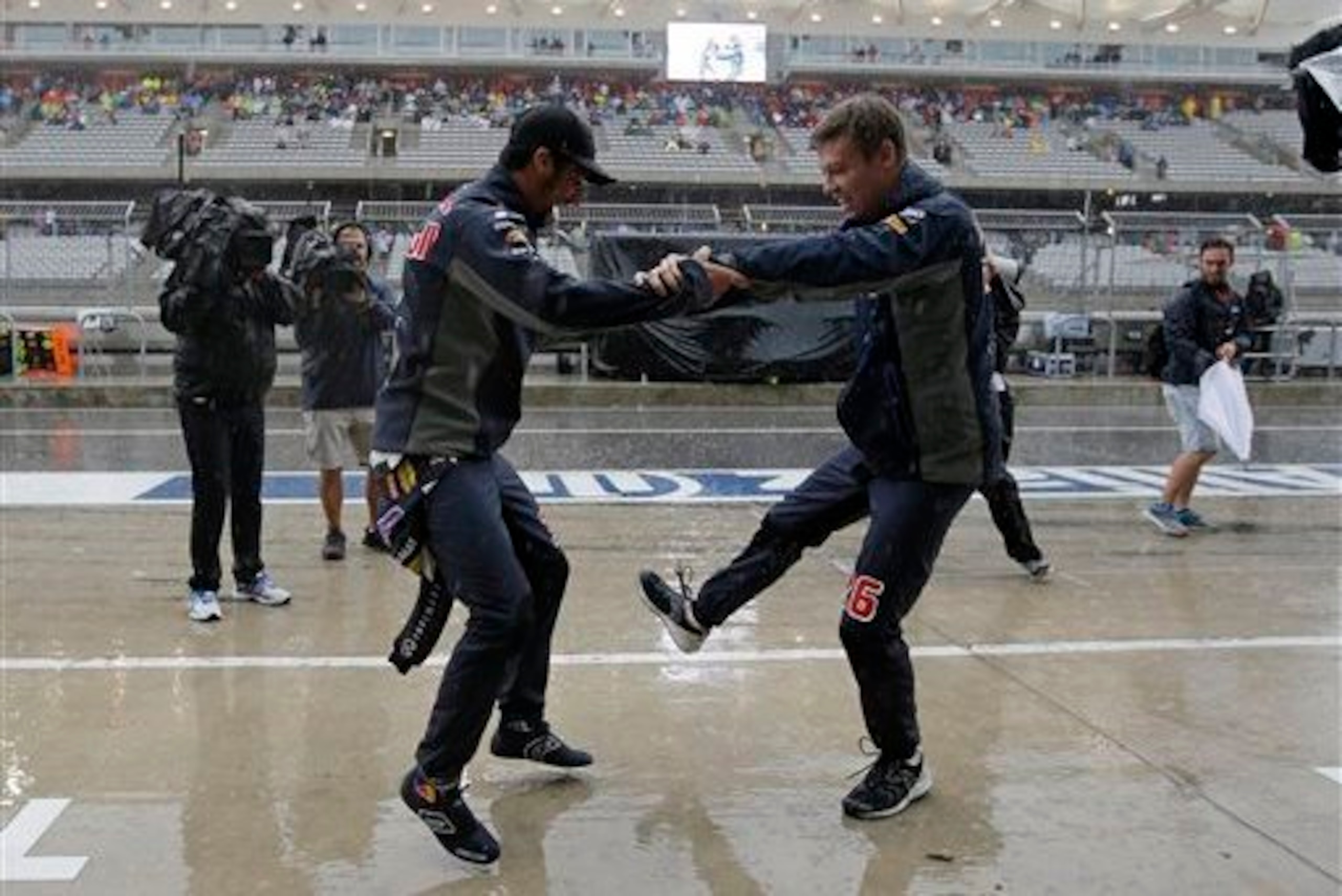 Ricciardo and Kvyat dancing in the pit lane in Austin.
