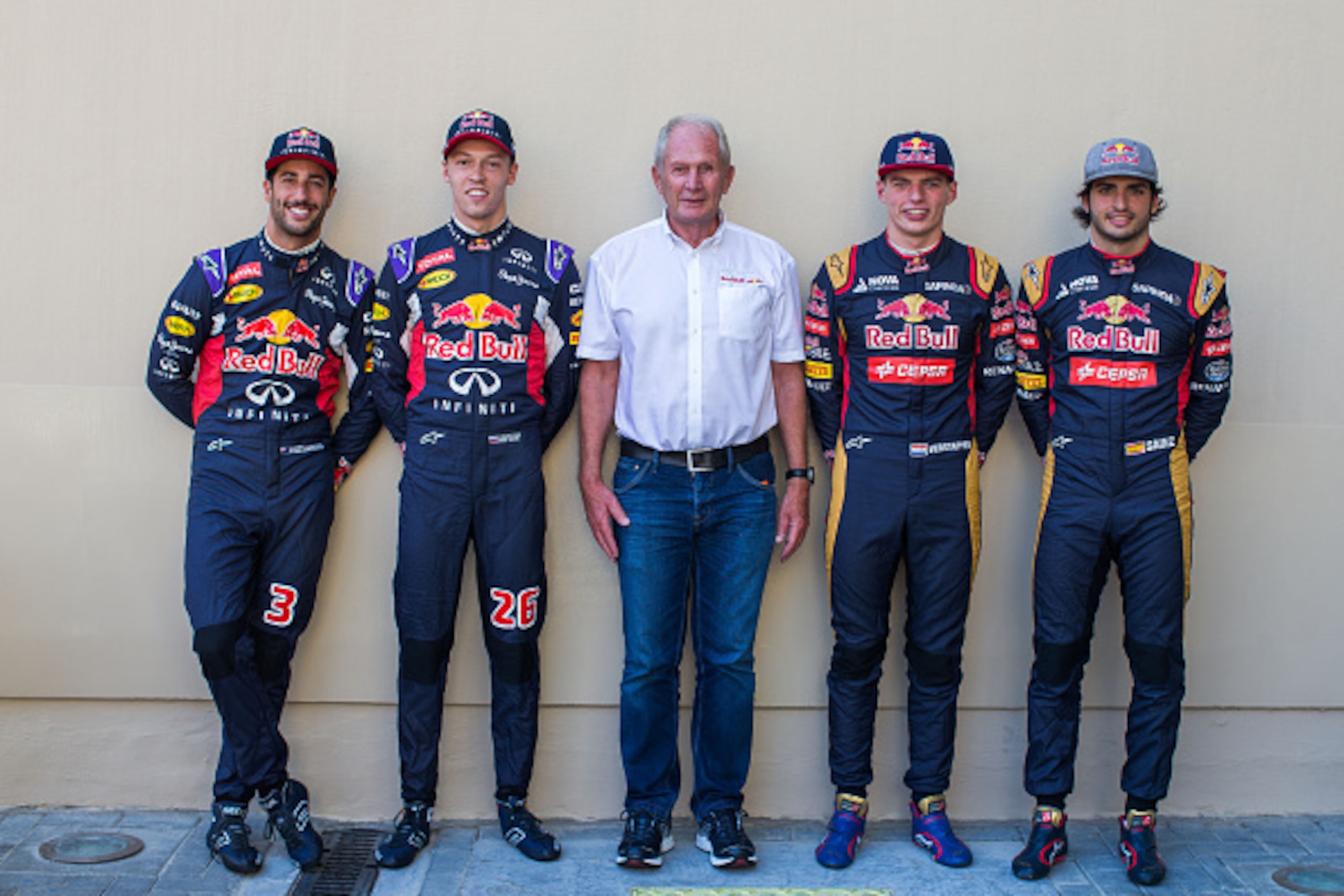 ABU DHABI, UNITED ARAB EMIRATES - NOVEMBER 29:  Daniel Ricciardo of Australia with Daniil Kvyat of Russia both of Infiniti Red Bull Racing with Helmut Marko of Austria and Infiniti Red Bull Racing and Max Verstappen of The Netherlands with Carlos Sainz of