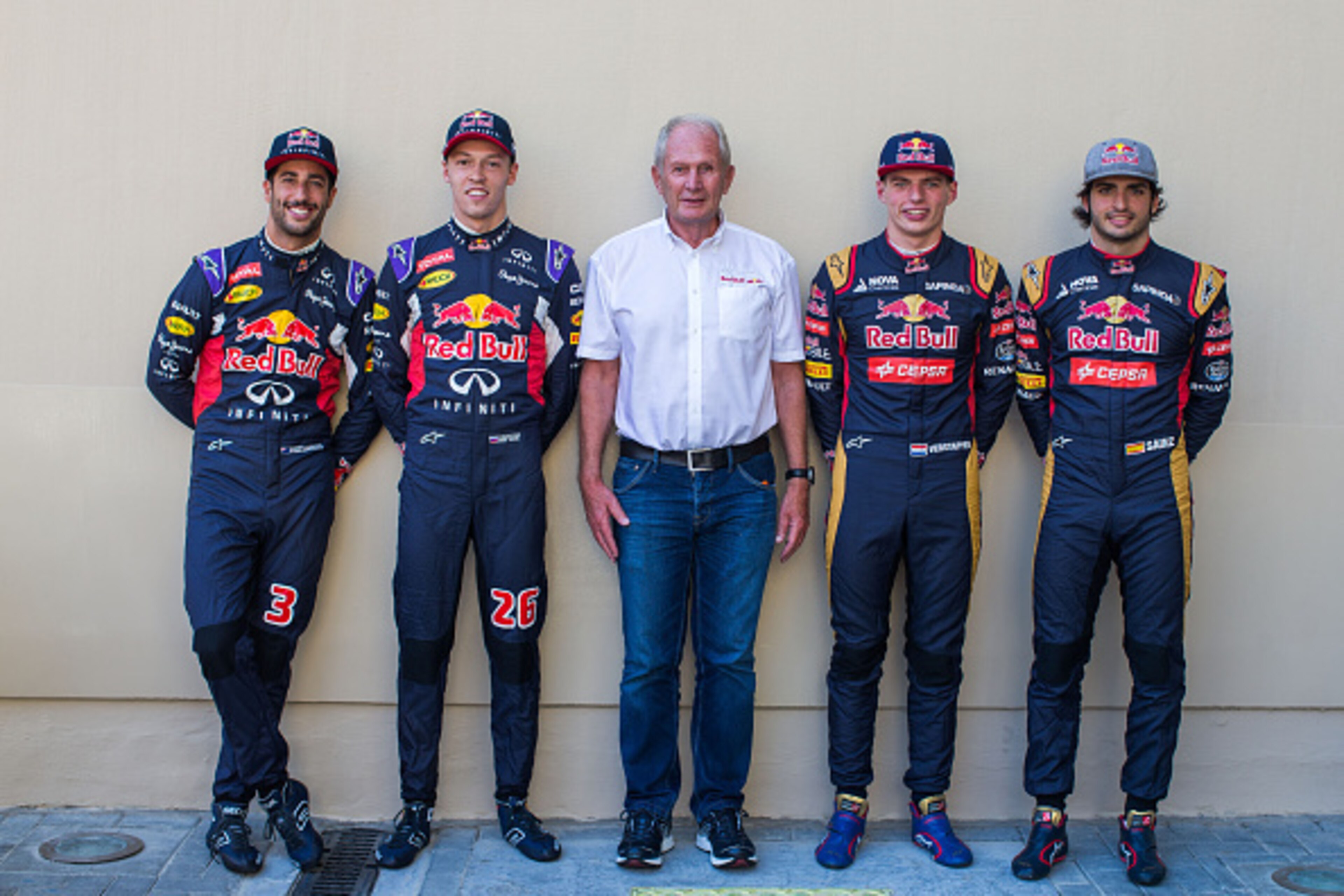 ABU DHABI, UNITED ARAB EMIRATES - NOVEMBER 29:  Daniel Ricciardo of Australia with Daniil Kvyat of Russia both of Infiniti Red Bull Racing with Helmut Marko of Austria and Infiniti Red Bull Racing and Max Verstappen of The Netherlands with Carlos Sainz of