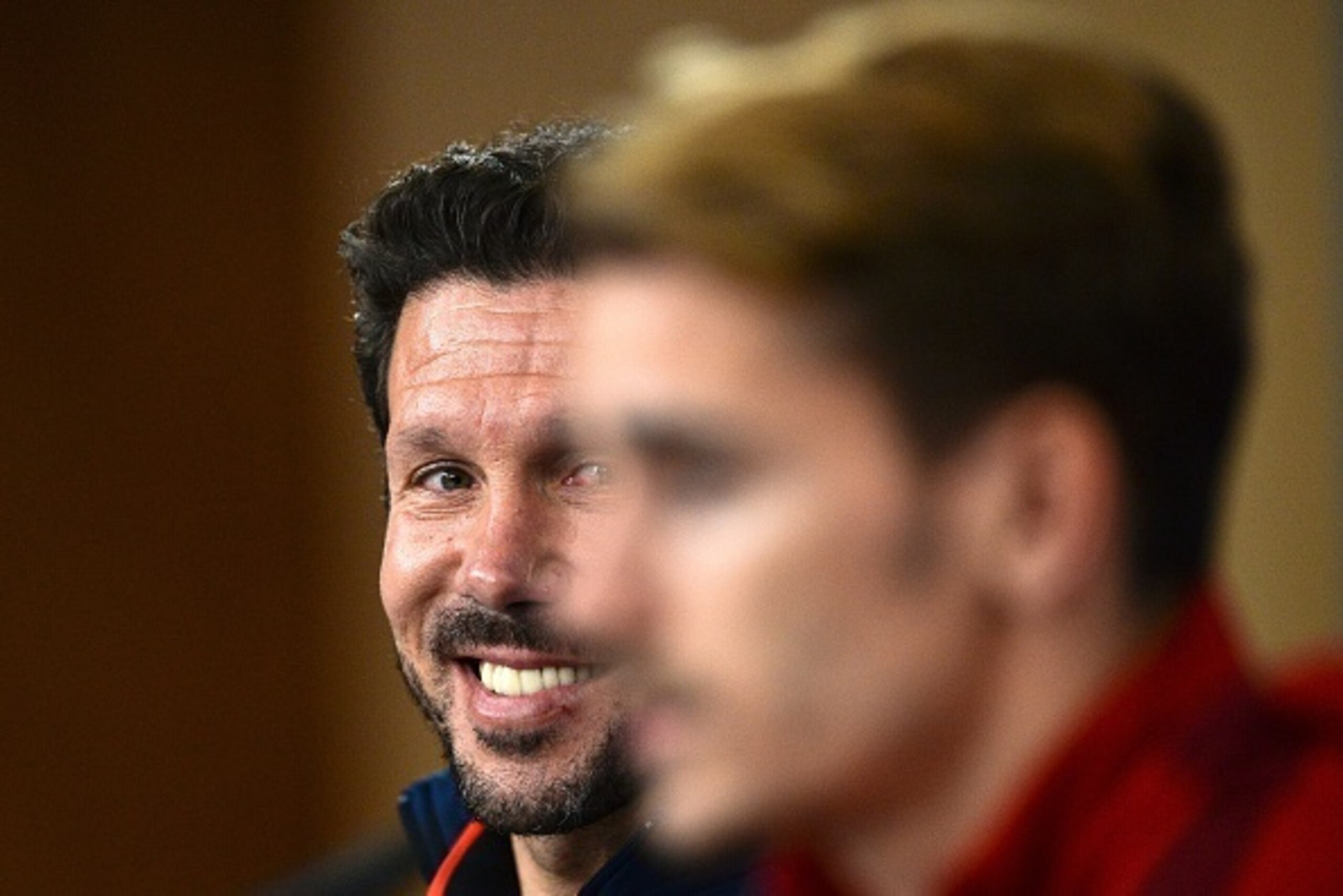 Atletico Madrid's head coach Diego Simeone (L) looks at Atletico Madrid's French midfielder Antoine Griezmann (R) durinfg a press conference at Luz stadium in Lisbon, on December 7, 2015 on the eve of the UEFA Champions League Group C football match betwe Atletico Madrid's head coach Diego Simeone (L) looks at Atletico Madrid's French midfielder Antoine Griezmann (R) durinfg a press conference at Luz stadium in Lisbon, on December 7, 2015 on the eve of the UEFA Champions League Group C football match betwe