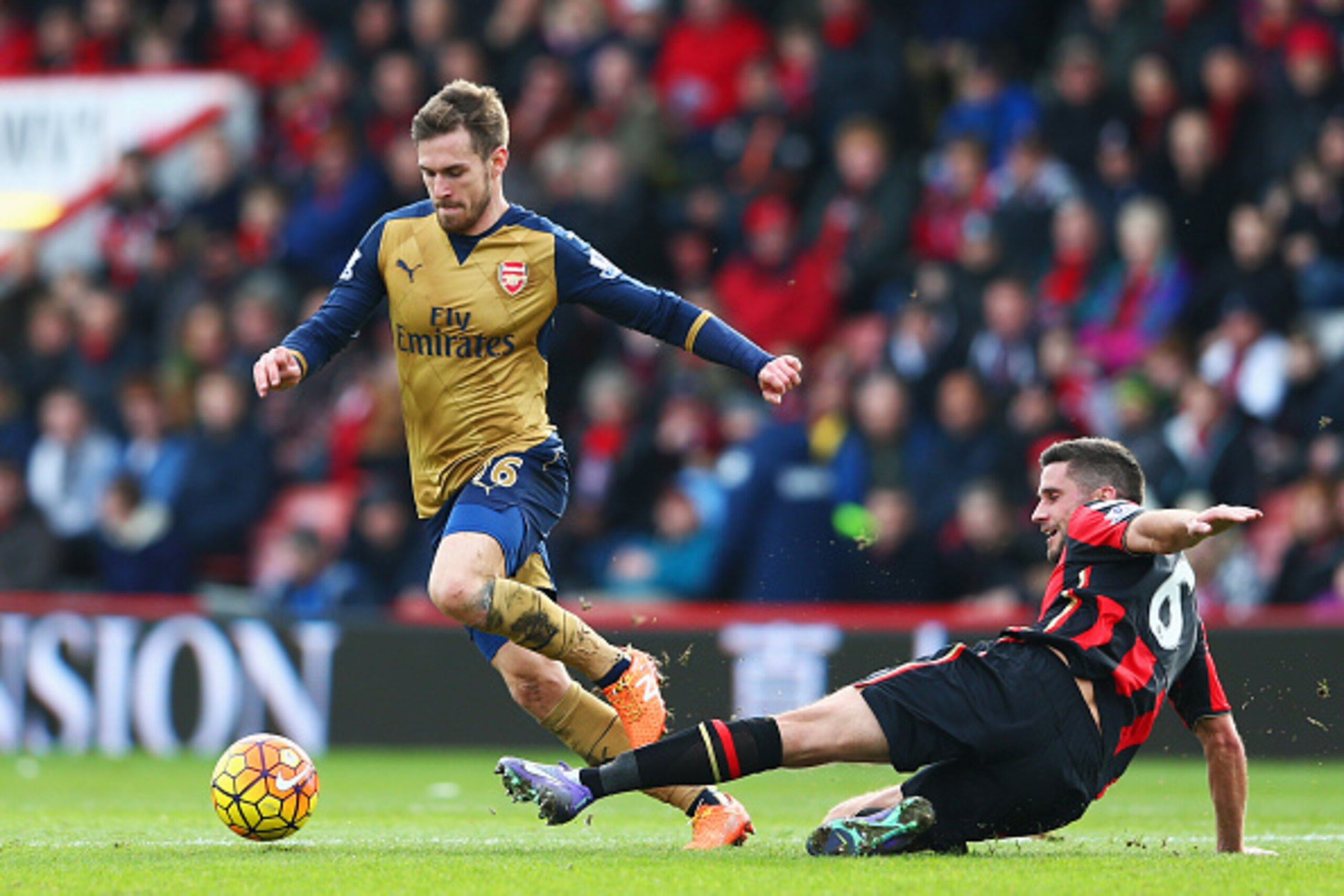 BOURNEMOUTH, ENGLAND - FEBRUARY 07:  Aaron Ramsey of Arsenal is challenged by Andrew Surman of Bournemouth during the Barclays Premier League match between A.F.C. Bournemouth and Arsenal at the Vitality Stadium on February 7, 2016 in Bournemouth, England.