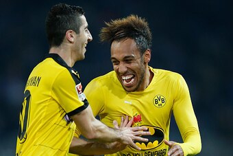 DORTMUND, GERMANY - NOVEMBER 08:  Henrikh Mkhitaryan (L) and Pierre-Emerick Aubameyang of Dortmund celebrate after winning the Bundesliga match between Borussia Dortmund and FC Schalke 04 at Signal Iduna Park on November 8, 2015 in Dortmund, Germany.  (Ph