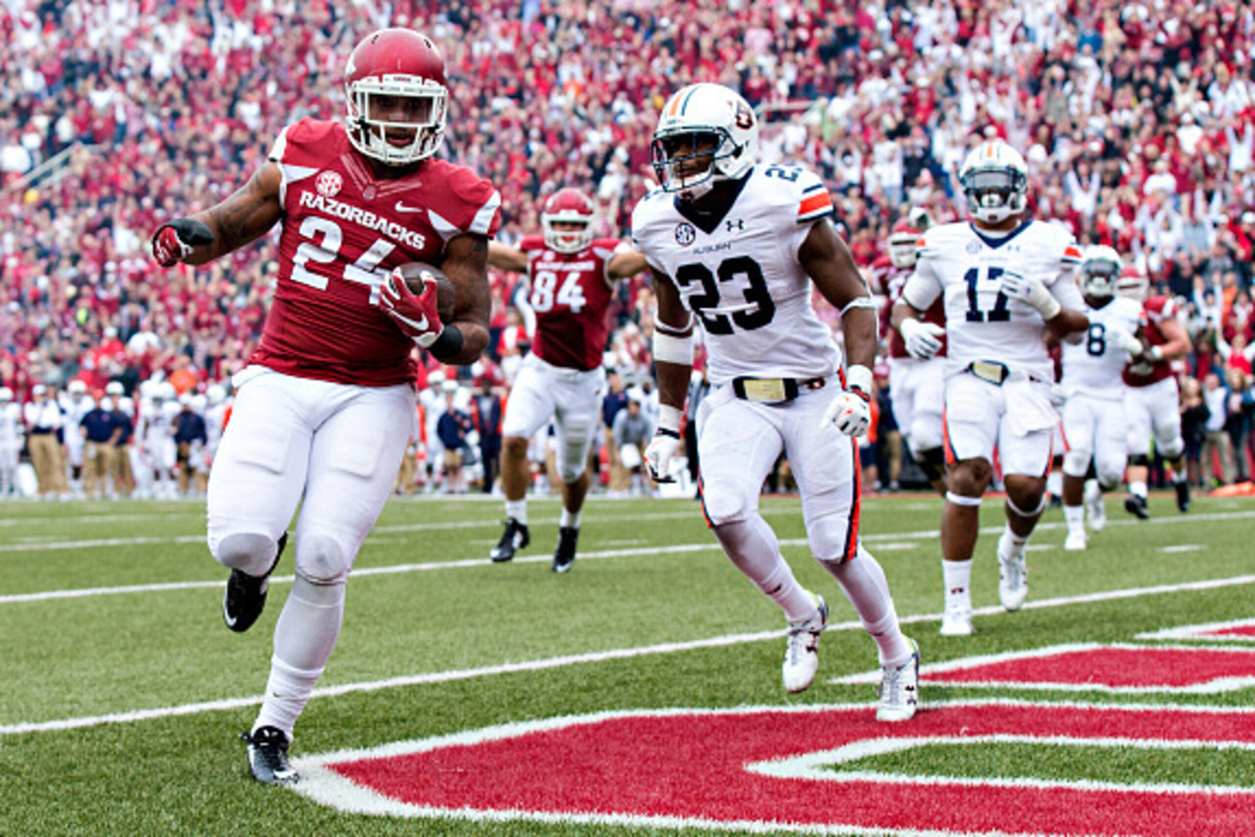 FAYETTEVILLE, AR - OCTOBER 24:  Kody Walker #24 of the Arkansas Razorbacks runs the ball for a touchdown in overtime against the Auburn Tigers at Razorback Stadium Stadium on October 24, 2015 in Fayetteville, Arkansas.  The Razorbacks defeated the Tigers 