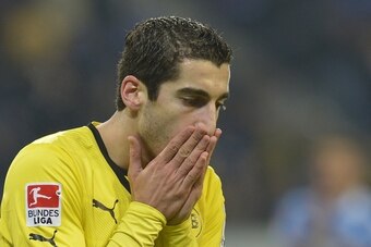 Dortmund's Armenian midfielder Henrikh Mkhitaryan reacts after he missed the goal during the German first division Bundesliga football match 1899 Hoffenheim vs Borussia Dortmund in Sinsheim, southwestern Germany, on December 14, 2013.     AFP PHOTO / THOM