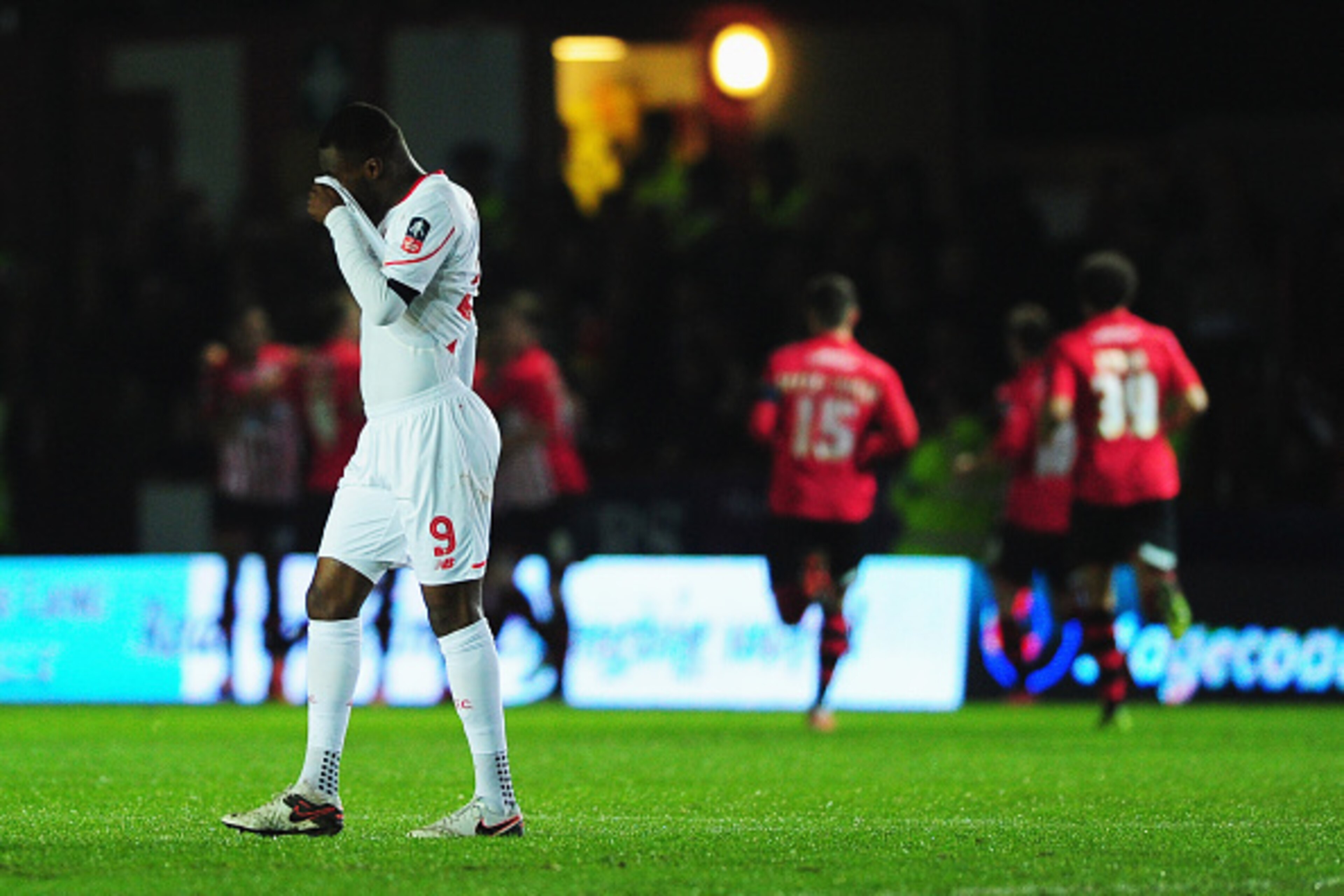 EXETER, ENGLAND - JANUARY 08:  Christian Benteke of Liverpool (9) reacts as Tom Nichols of Exeter City scores the opening goal during the Emirates FA Cup third round match between Exeter City and Liverpool at St James Park on January 8, 2016 in Exeter, En