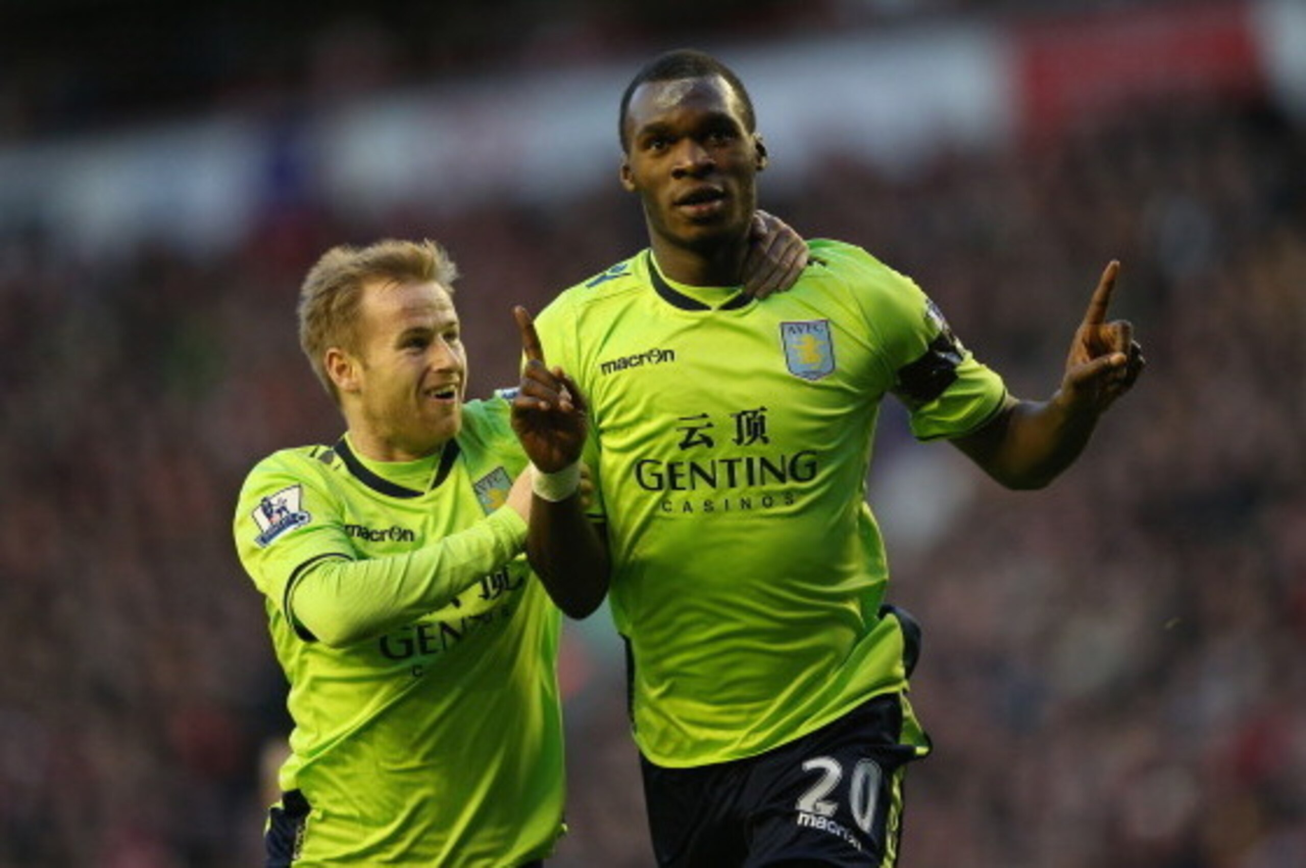 LIVERPOOL, ENGLAND - DECEMBER 15:  Christian Benteke of Aston Villa celebrates after scoring the first goal with team mate Barry Bannan during the Barclays Premier League match between Liverpool and Aston Villa at Anfield on  December 15, 2012 in Liverpoo