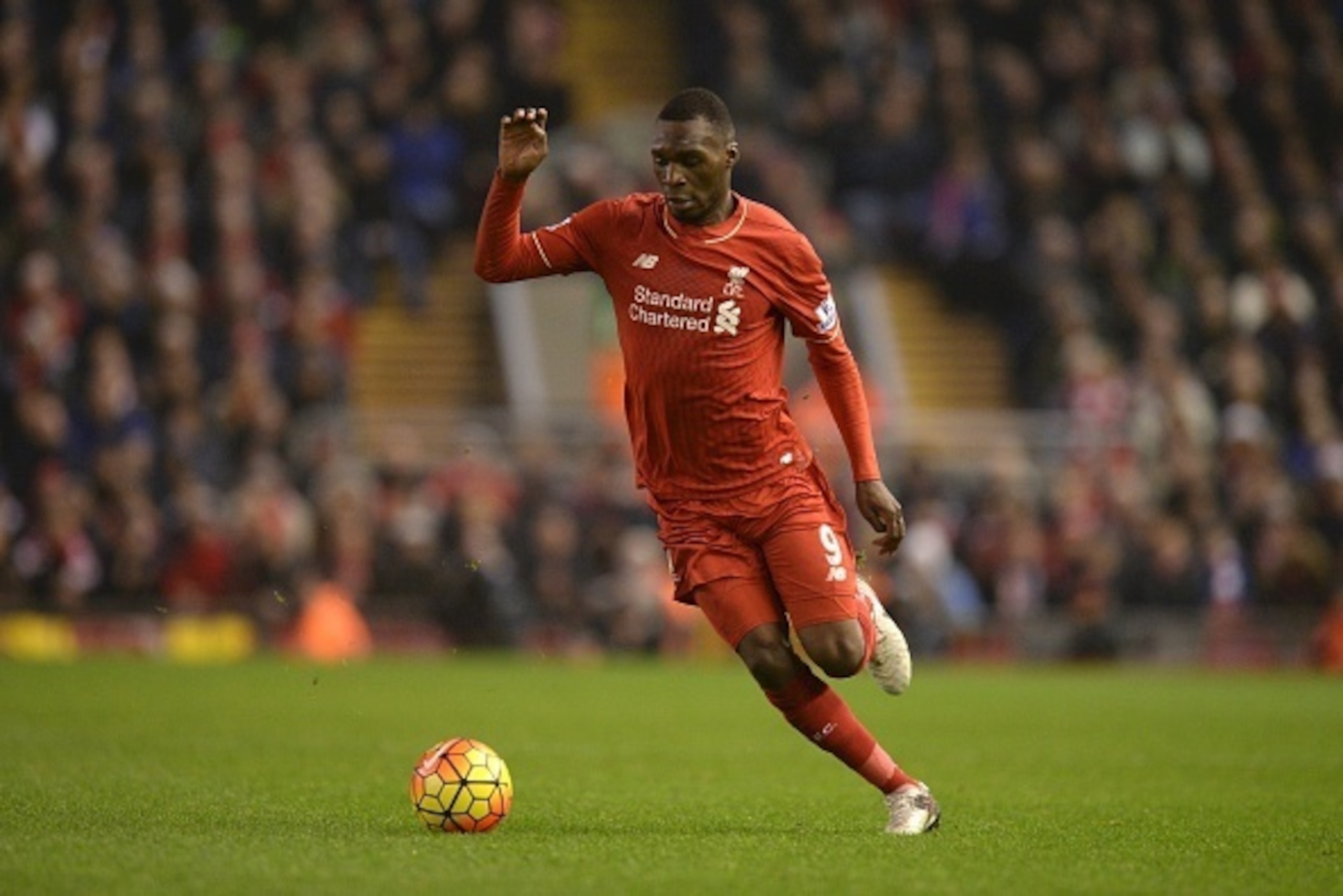 Liverpool's Zaire-born Belgian striker Christian Benteke runs with the ball during the English Premier League football match between Liverpool and West Bromwich Albion at Anfield in Liverpool, northwest England, on December 13, 2015.  AFP PHOTO / OLI SCAR