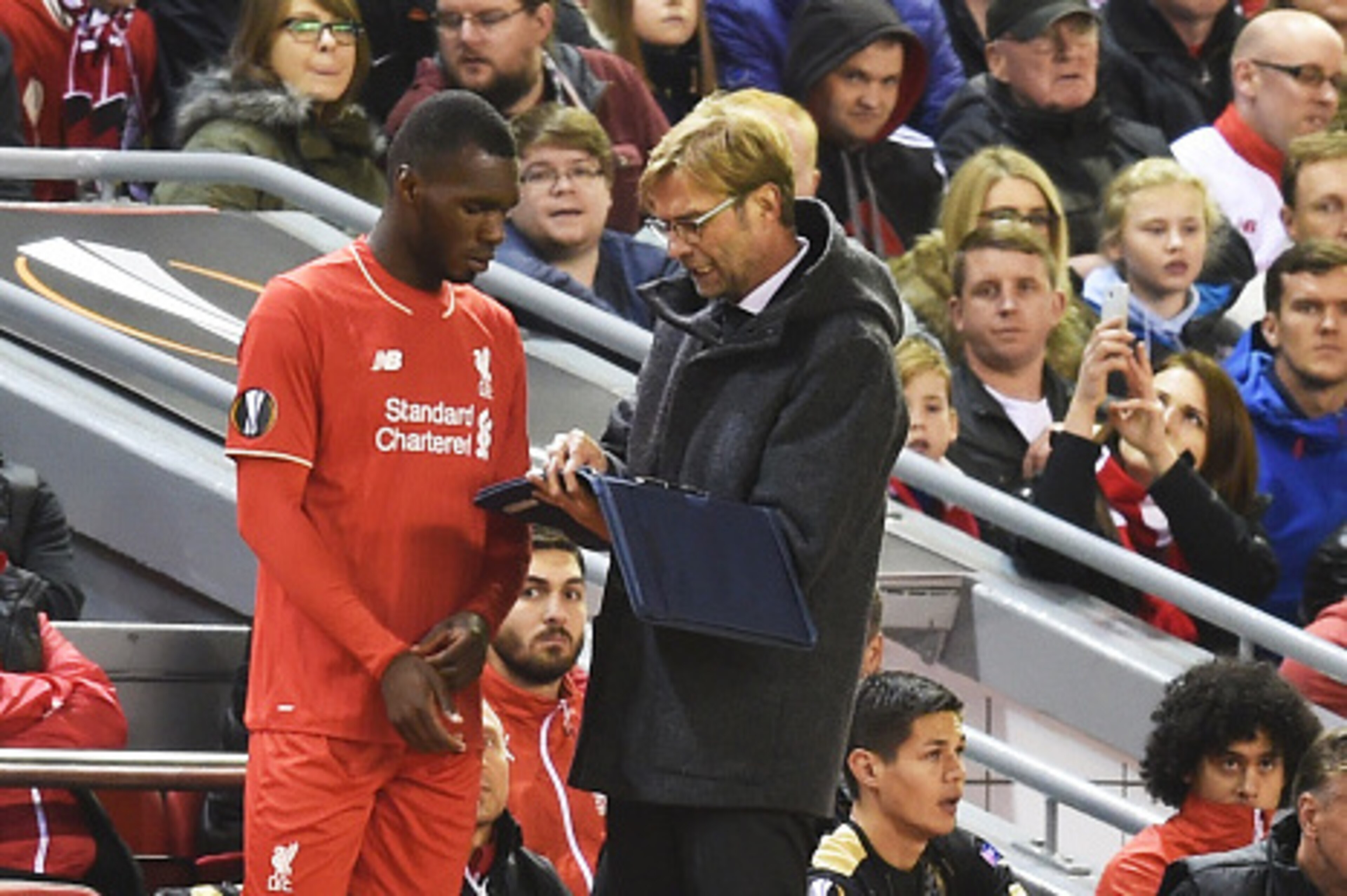 LIVERPOOL, ENGLAND - OCTOBER 22:  Christian Benteke of Liverpool receives instructions from Jurgen Klopp the manager of Liverpool as he prepares to come on as a second half substitute during the UEFA Europa League Group B match between Liverpool FC and Ru
