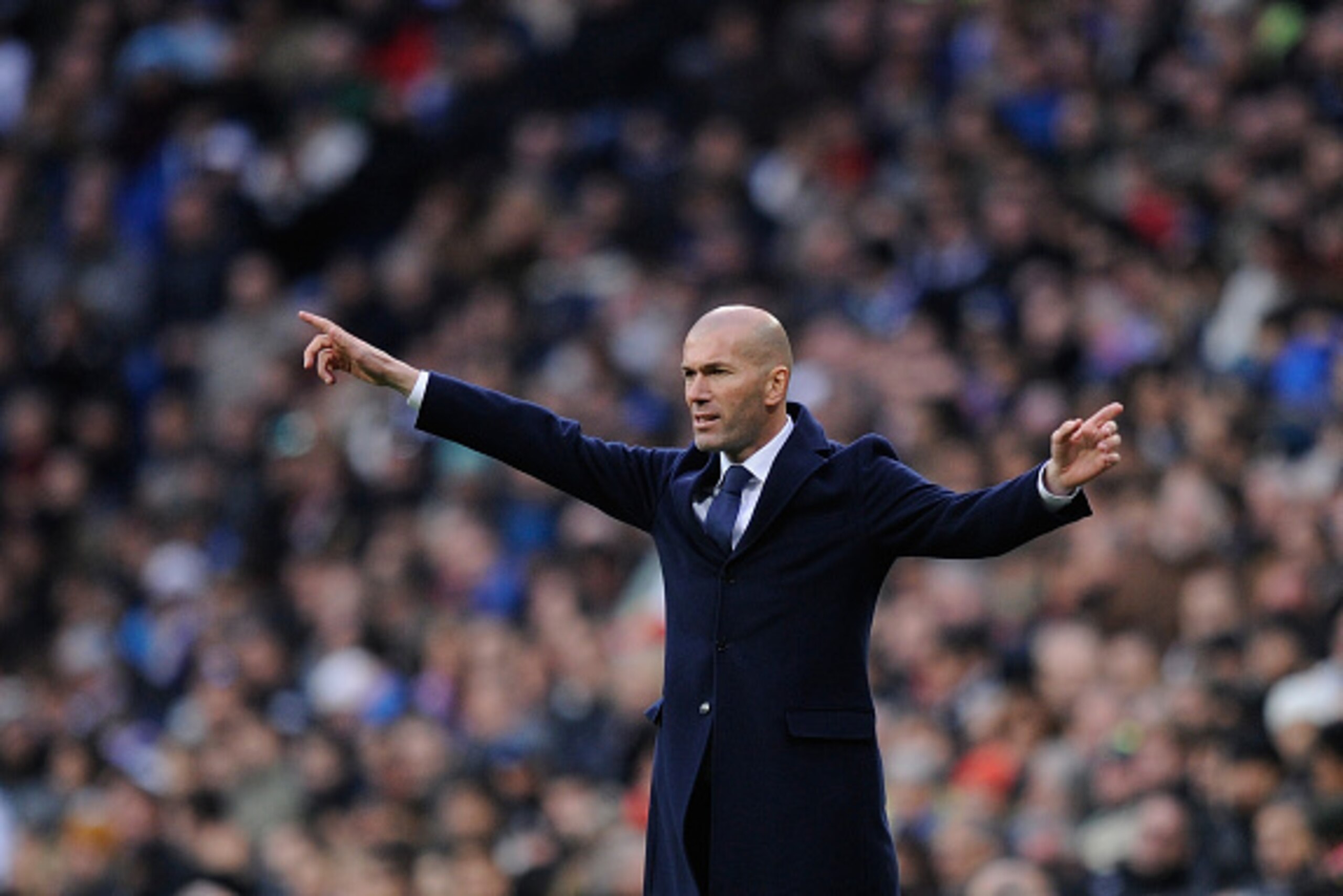 MADRID, SPAIN - JANUARY 17:  Zinedine Zidane manager of Real Madrid reacts during the La Liga match between Real Madrid CF and Sporting Gijon at Estadio Santiago Bernabeu on January 17, 2016 in Madrid, Spain.  (Photo by Denis Doyle/Getty Images)