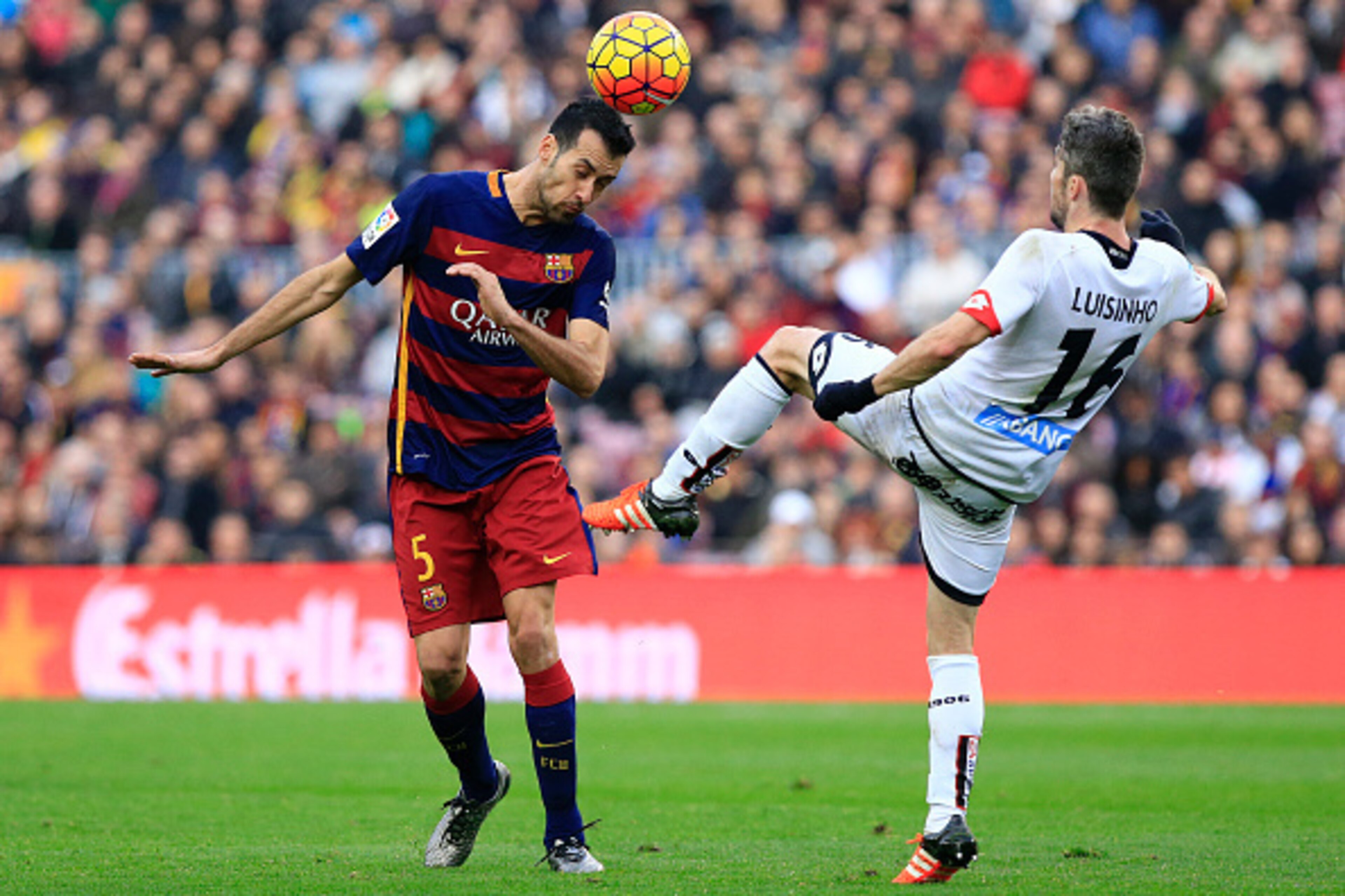 FC Barcelona's Spanish midfielder Sergio Busquets (L) vies with Deportivo de La Coruna's Portuguese midfielder Luisinho during the Spanish league football match FC Barcelona vs Deportivo de La Coruna at the Camp Nou stadium in Barcelona on December 12, 20 FC Barcelona's Spanish midfielder Sergio Busquets (L) vies with Deportivo de La Coruna's Portuguese midfielder Luisinho during the Spanish league football match FC Barcelona vs Deportivo de La Coruna at the Camp Nou stadium in Barcelona on December 12, 20