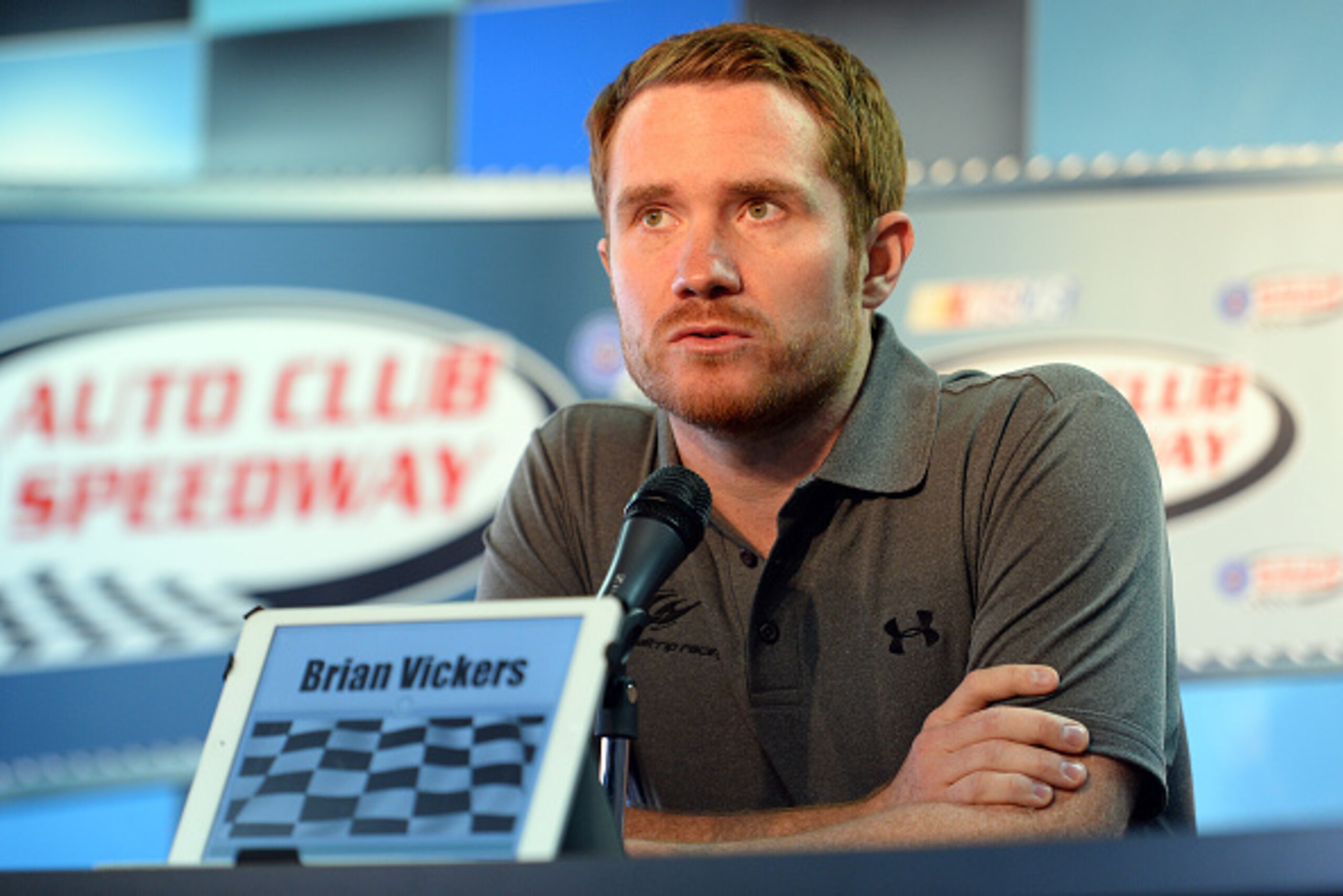 FONTANA, CA - MARCH 22: Brian Vickers, driver of the Michael Waltrip Racing Toyota, answers questions from media during a press conference before the NASCAR Sprint Cup Series Auto Club 400 at Auto Club Speedway on March 22, 2015 in Fontana, California. FONTANA, CA - MARCH 22: Brian Vickers, driver of the Michael Waltrip Racing Toyota, answers questions from media during a press conference before the NASCAR Sprint Cup Series Auto Club 400 at Auto Club Speedway on March 22, 2015 in Fontana, California.
