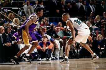NEW YORK - FEBRUARY 14:  Grant Hill #33 of the Eastern Conference All-Stars digs in on defense against Kobe Bryant #8 of the Western Conference All-Stars during the 1998 NBA All-Star game played February 14, 1998 at Madison Square Garden in New York, New 