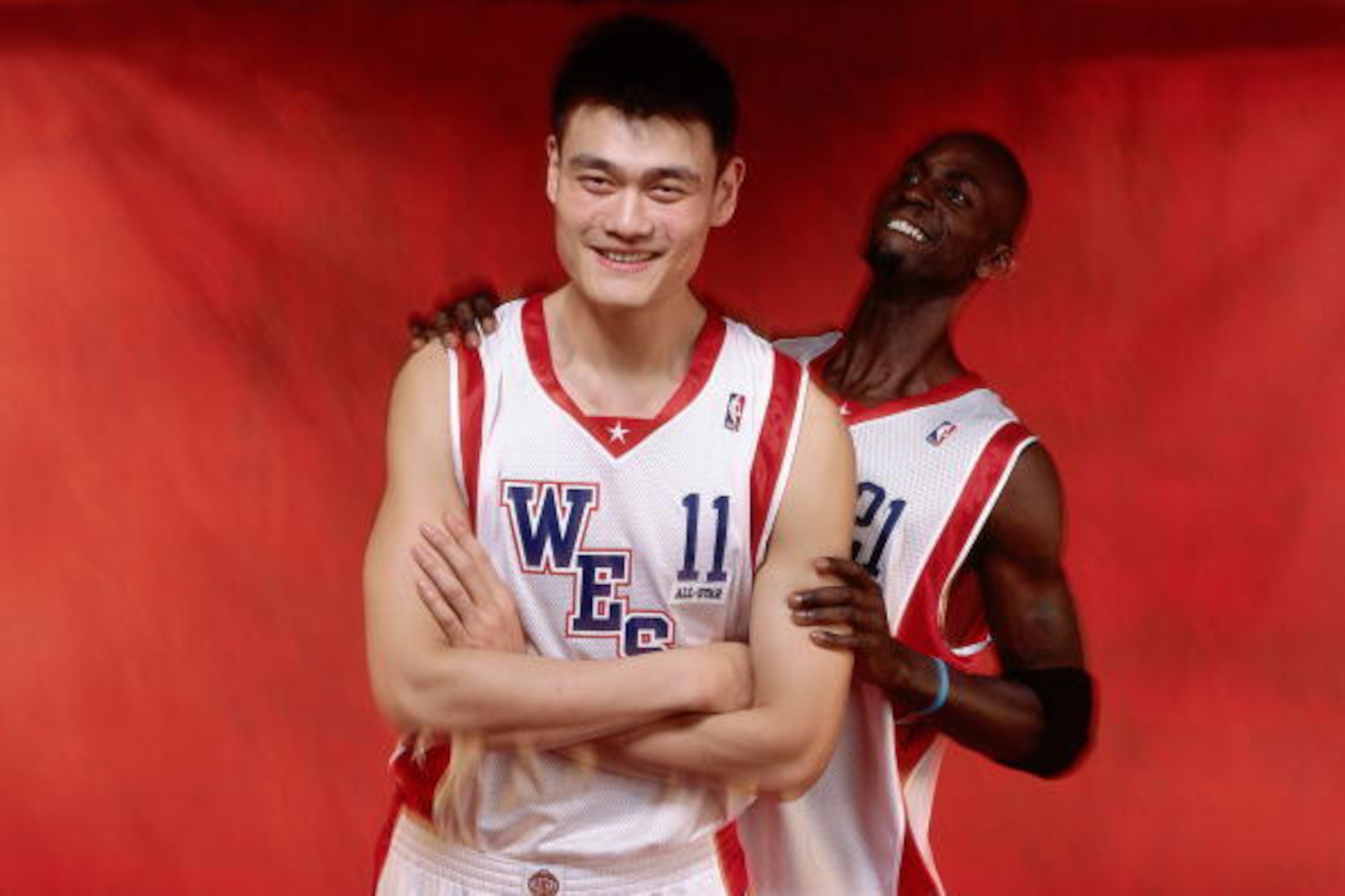 LOS ANGELES - FEBRUARY 15:  Yao Ming #11 and Kevin Garnett #21 of the Western Conference All-Stars pose for a portrait on February 15, 2004 at Staples Center in Los Angeles, California. NOTE TO USER: User expressly acknowledges and agrees that, by downloa