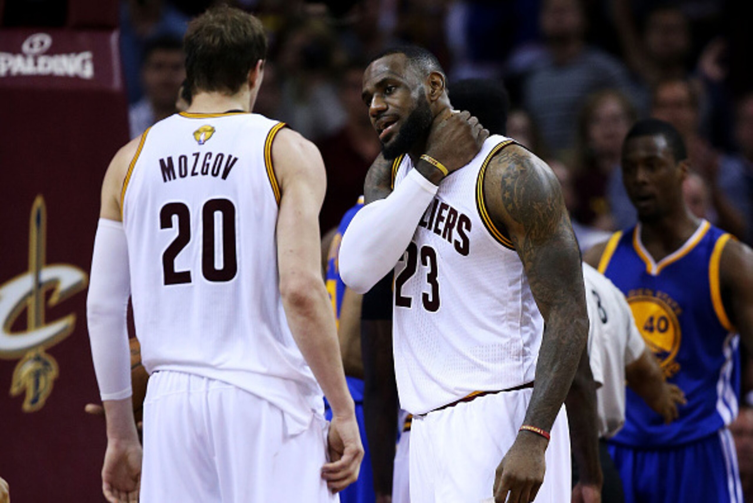 CLEVELAND, OH - JUNE 16:  LeBron James #23 talks to Timofey Mozgov #20 of the Cleveland Cavaliers in the second quarter against the Golden State Warriors during Game Six of the 2015 NBA Finals at Quicken Loans Arena on June 16, 2015 in Cleveland, Ohio. NO