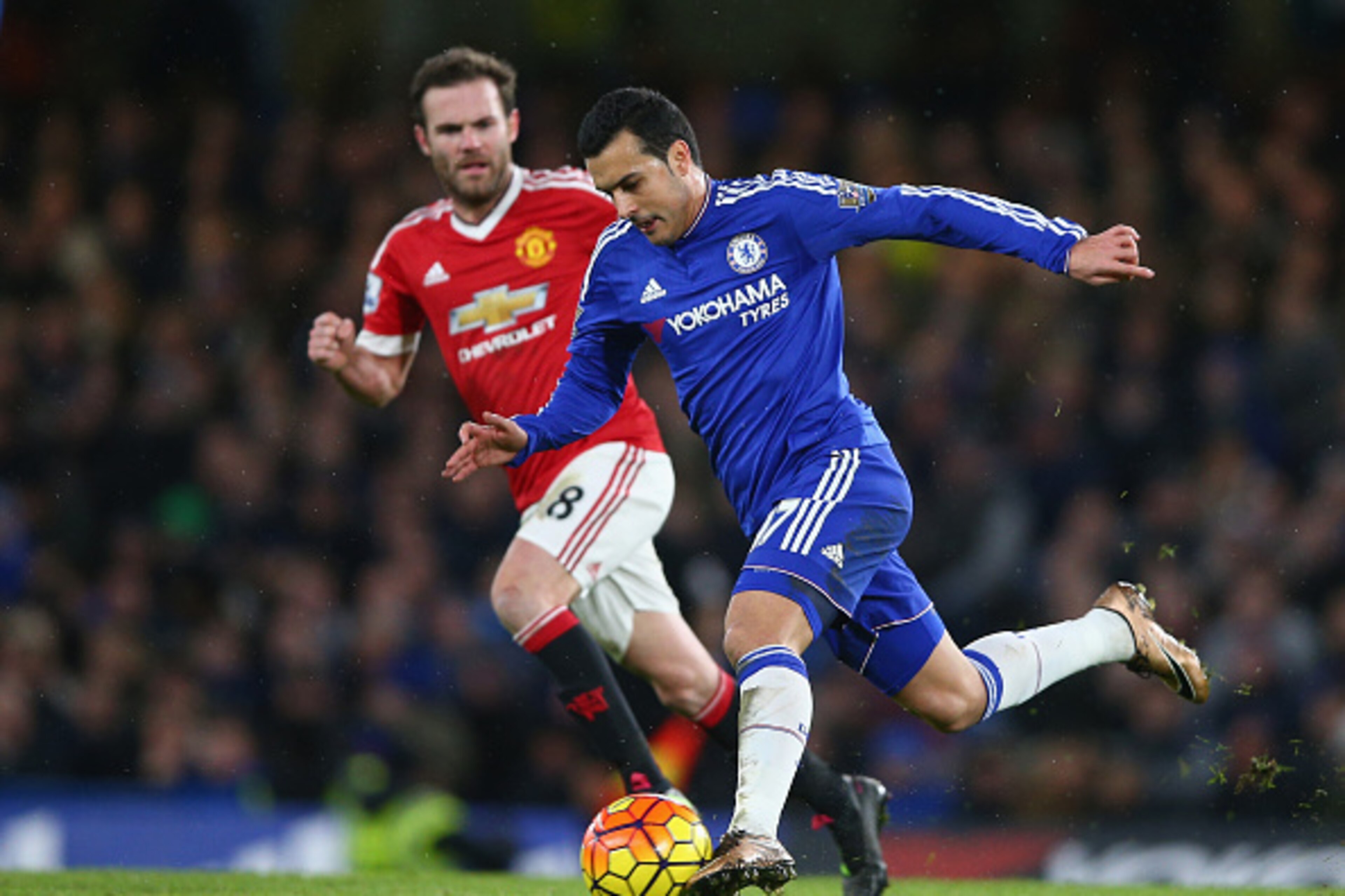 LONDON, ENGLAND - FEBRUARY 07: Pedro of Chelsea and Juan Mata of Manchester United in action during the Barclays Premier League match between Chelsea and Manchester United at Stamford Bridge on February 7, 2016 in London, England.  (Photo by Paul Gilham/G