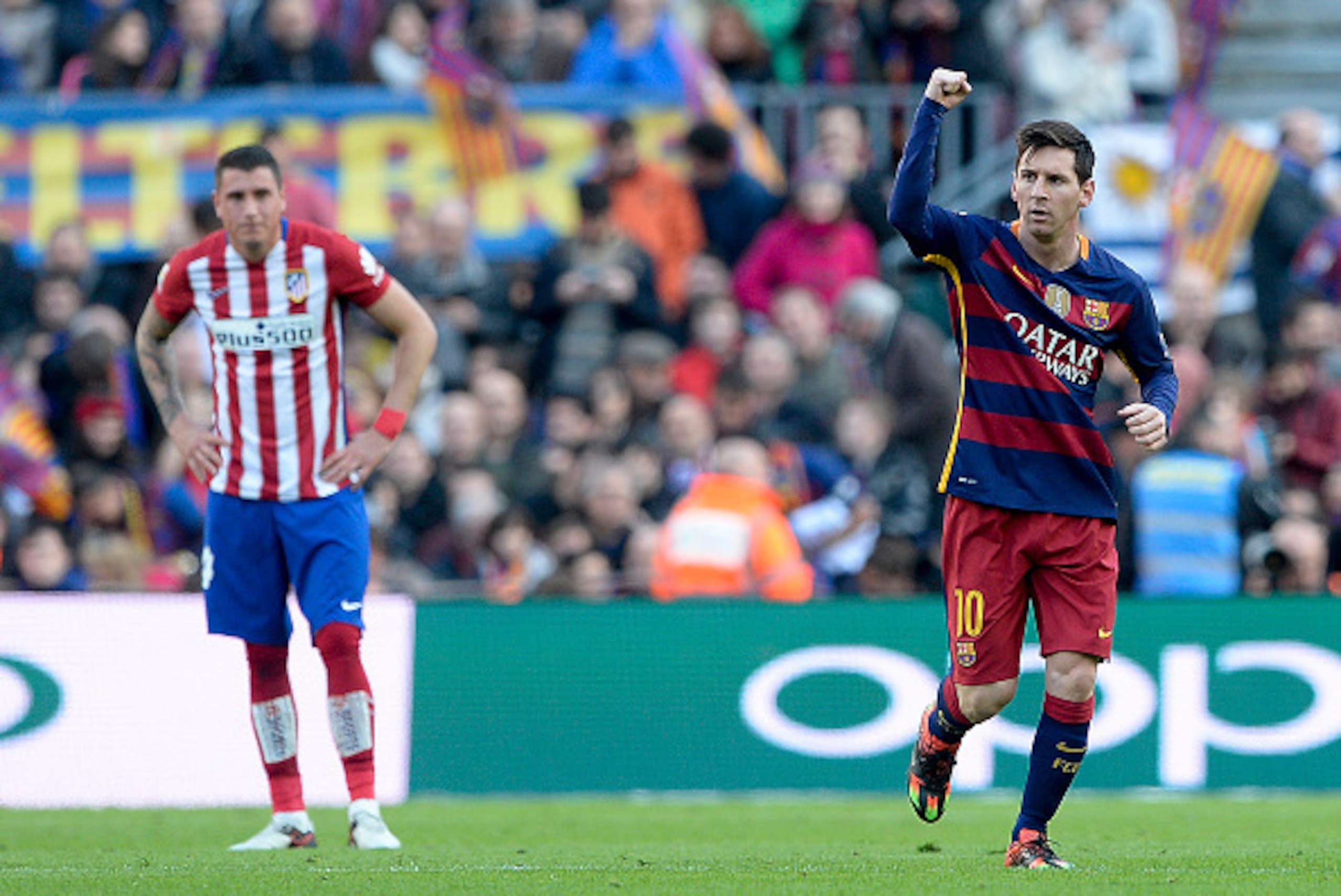 Barcelona's Argentinian forward Lionel Messi (R) celebrates his goal during the Spanish league football match FC Barcelona vs Club Atletico de Madrid at the Camp Nou stadium in Barcelona on January 30, 2016.   AFP PHOTO/ JOSEP LAGO / AFP / JOSEP LAGO     