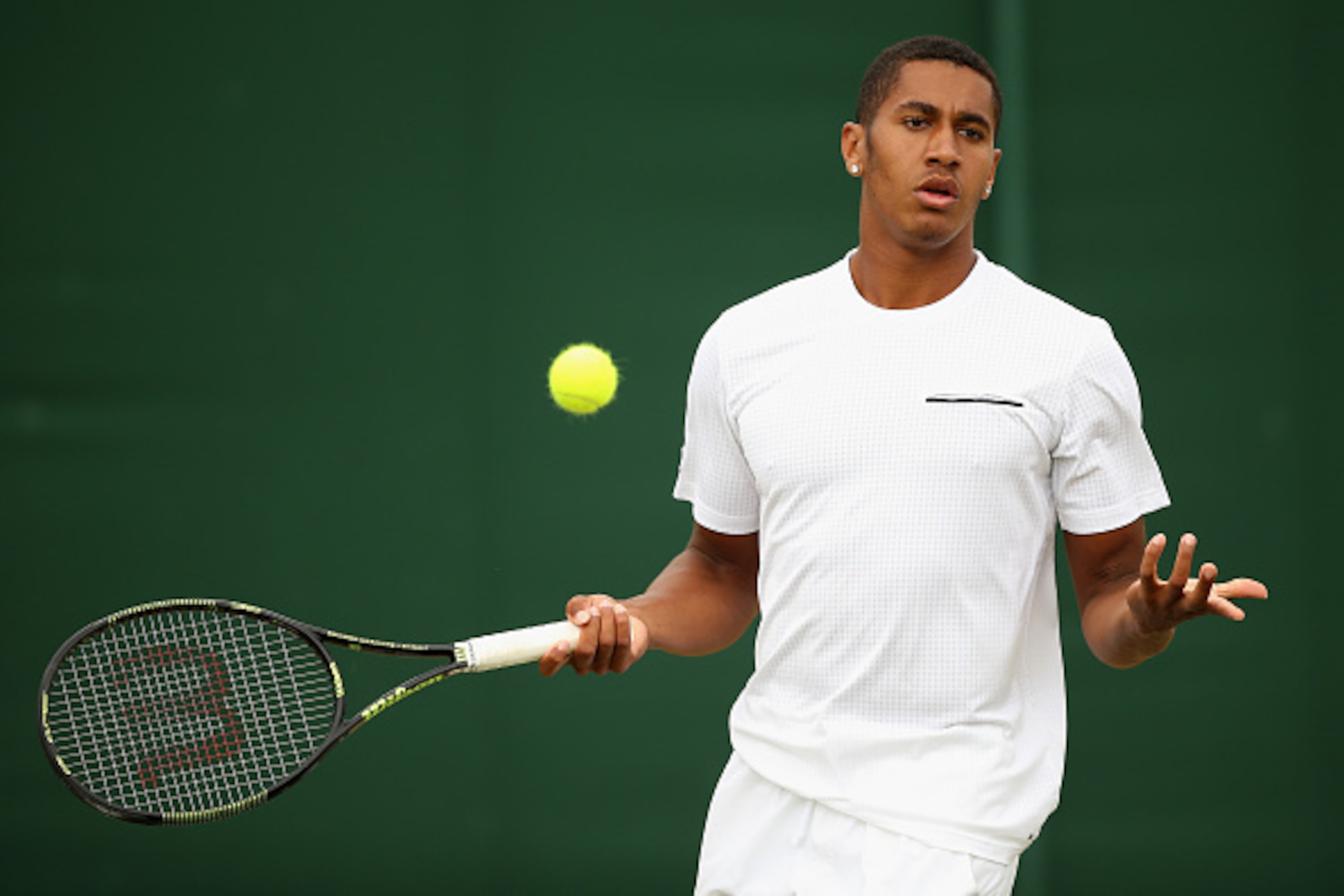 LONDON, ENGLAND - JULY 06:  Michael Mmoh of the United States reacts in his Boy's Singles First Round match against Geoffrey Blancaneaux of France during day seven of the Wimbledon Lawn Tennis Championships at the All England Lawn Tennis and Croquet Club 