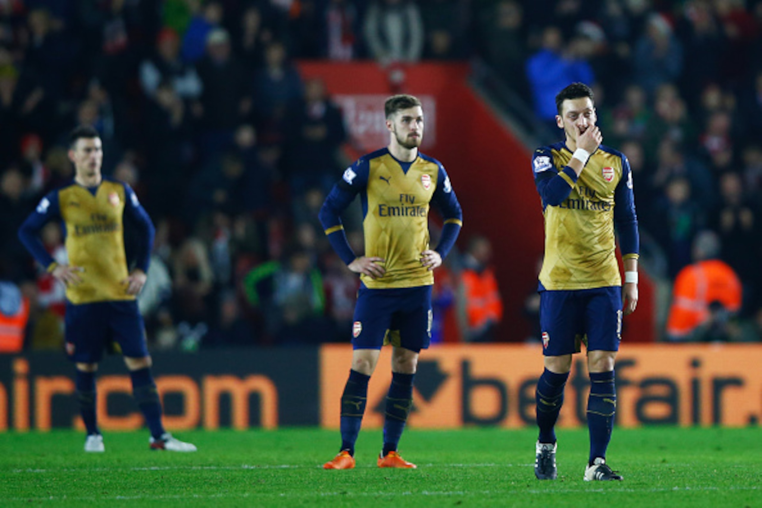 SOUTHAMPTON, ENGLAND - DECEMBER 26: (L-R)Laurent Koscielny, Aaron Ramsey and Mesut Ozil of Arsenal look dejected during the Barclays Premier League match between Southampton and Arsenal at St Mary's Stadium on December 26, 2015 in Southampton, England. SOUTHAMPTON, ENGLAND - DECEMBER 26: (L-R)Laurent Koscielny, Aaron Ramsey and Mesut Ozil of Arsenal look dejected during the Barclays Premier League match between Southampton and Arsenal at St Mary's Stadium on December 26, 2015 in Southampton, England.