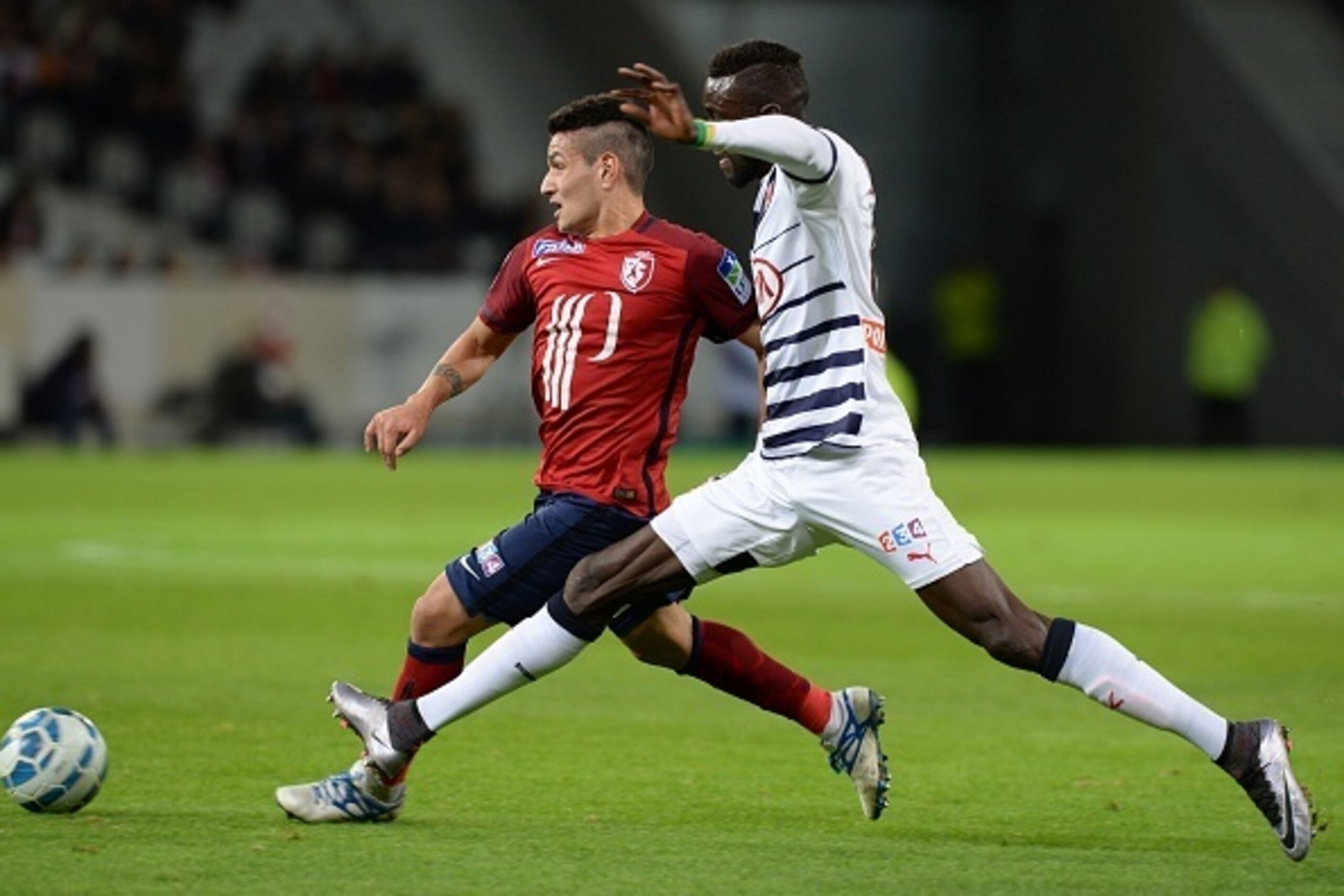Lille's midfielder Rony Lopes (L) vies with Bordeaux's Senegalese defender Lamine Sane during the French League Cup football match Lille (LOSC) versus Bordeaux at the Stade Pierre Mauroy stadium in Villeneuve-d'Ascq, northern France, on January 26, 2016. Lille's midfielder Rony Lopes (L) vies with Bordeaux's Senegalese defender Lamine Sane during the French League Cup football match Lille (LOSC) versus Bordeaux at the Stade Pierre Mauroy stadium in Villeneuve-d'Ascq, northern France, on January 26, 2016.