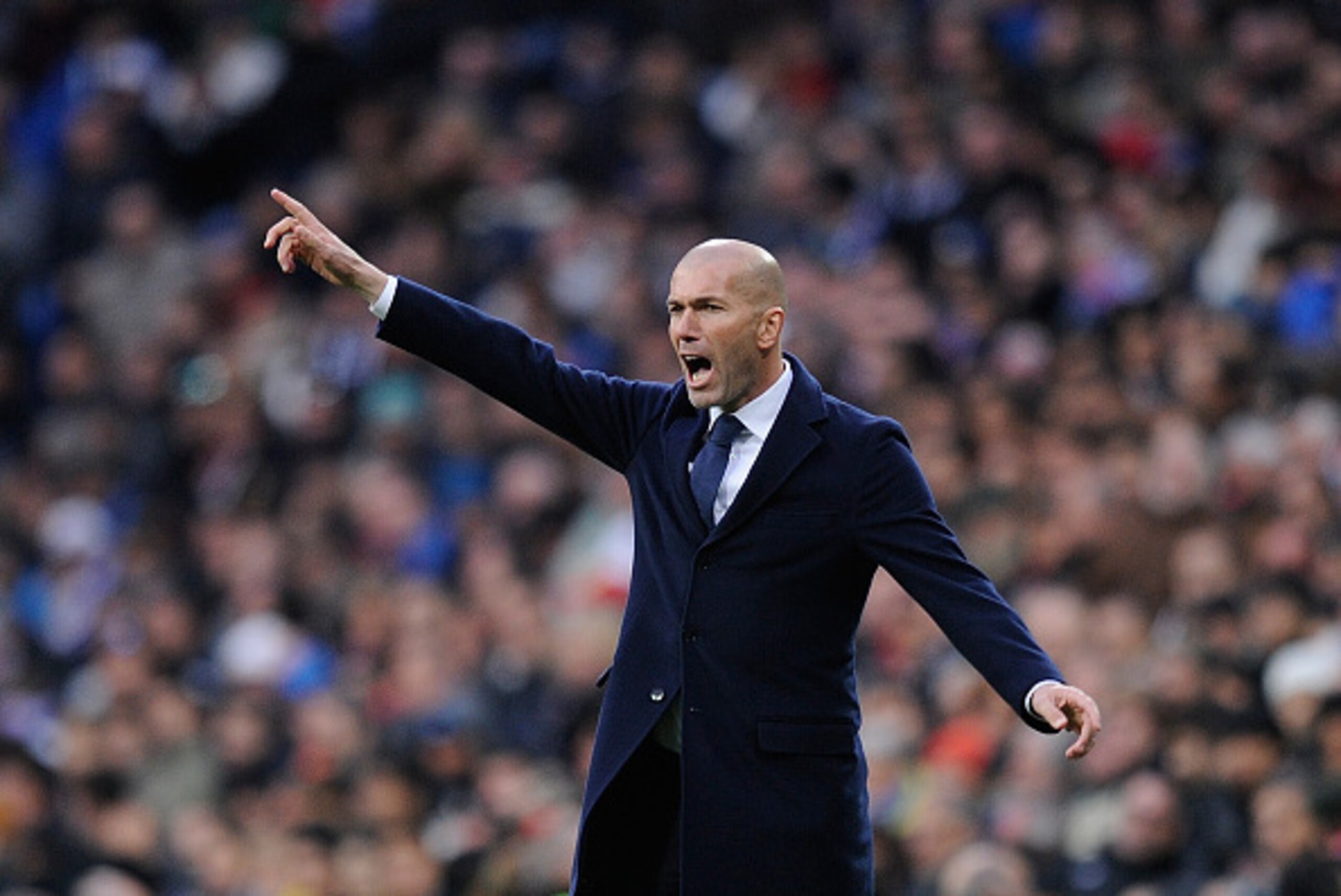 MADRID, SPAIN - JANUARY 17: Zinedine Zidane manager of Real Madrid reacts during the La Liga match between Real Madrid CF and Sporting Gijon at Estadio Santiago Bernabeu on January 17, 2016 in Madrid, Spain. (Photo by Denis Doyle/Getty Images) MADRID, SPAIN - JANUARY 17: Zinedine Zidane manager of Real Madrid reacts during the La Liga match between Real Madrid CF and Sporting Gijon at Estadio Santiago Bernabeu on January 17, 2016 in Madrid, Spain. (Photo by Denis Doyle/Getty Images)